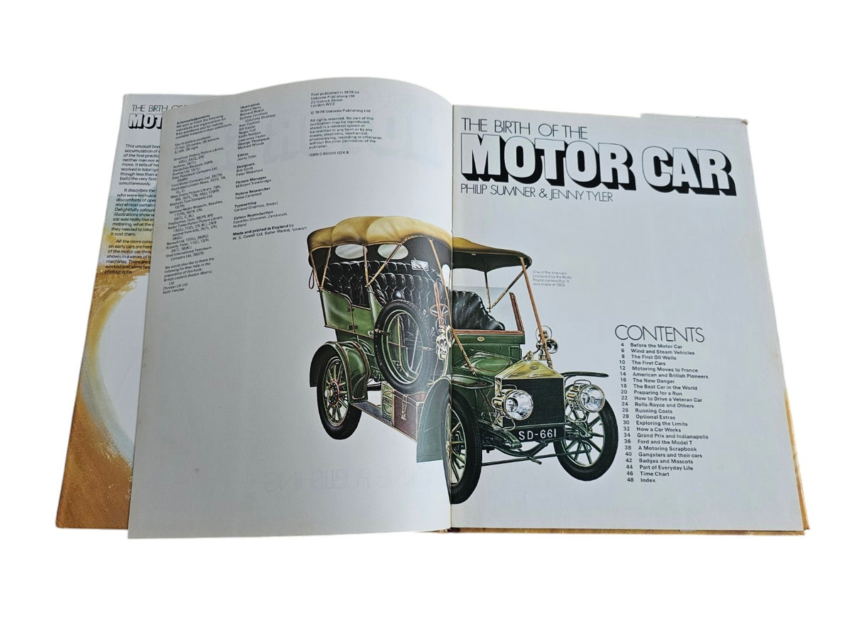 Open book spread showing a vintage green car illustration and contents text.