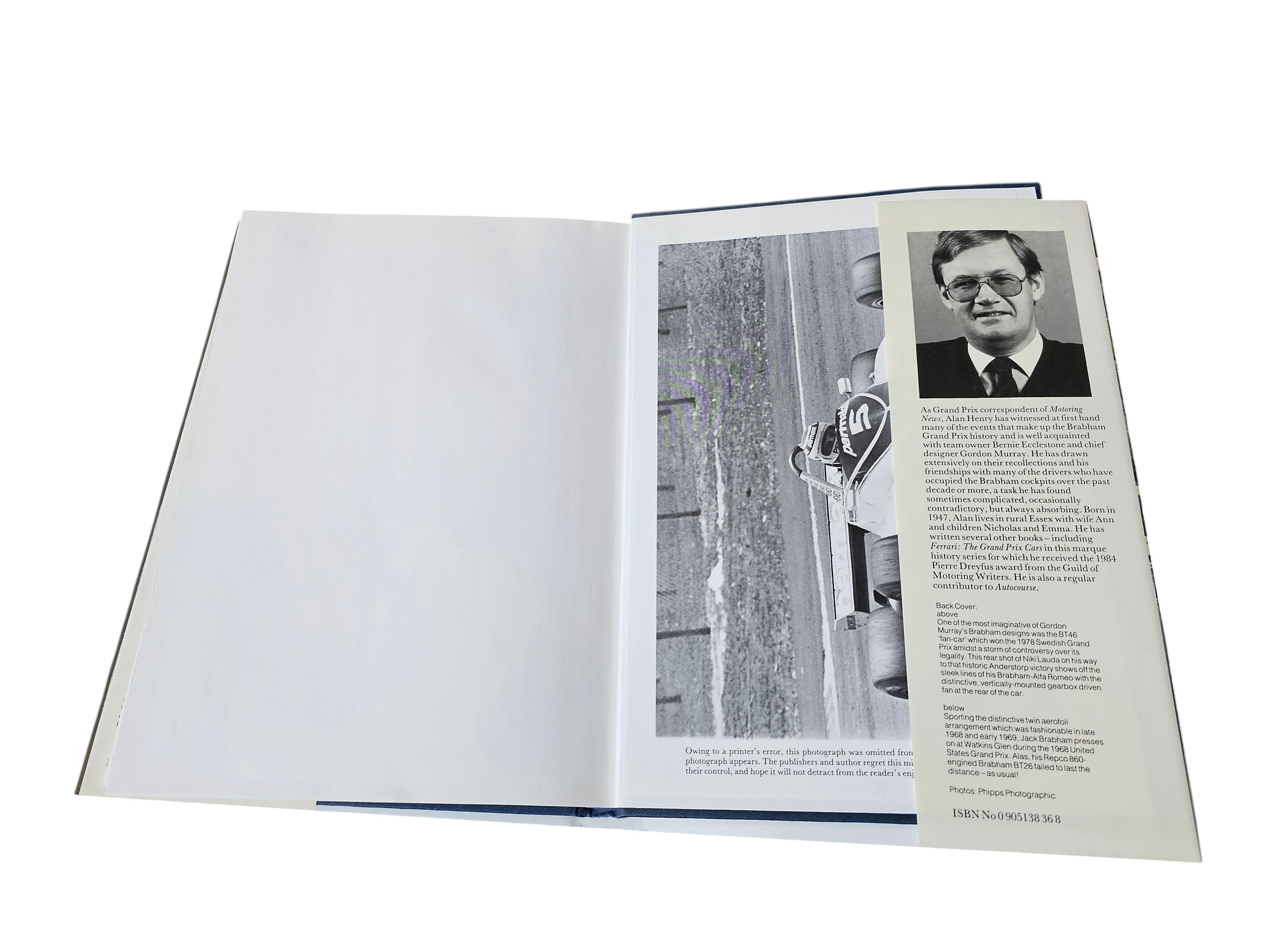 Open hardcover book with blank left page and portrait page on right
