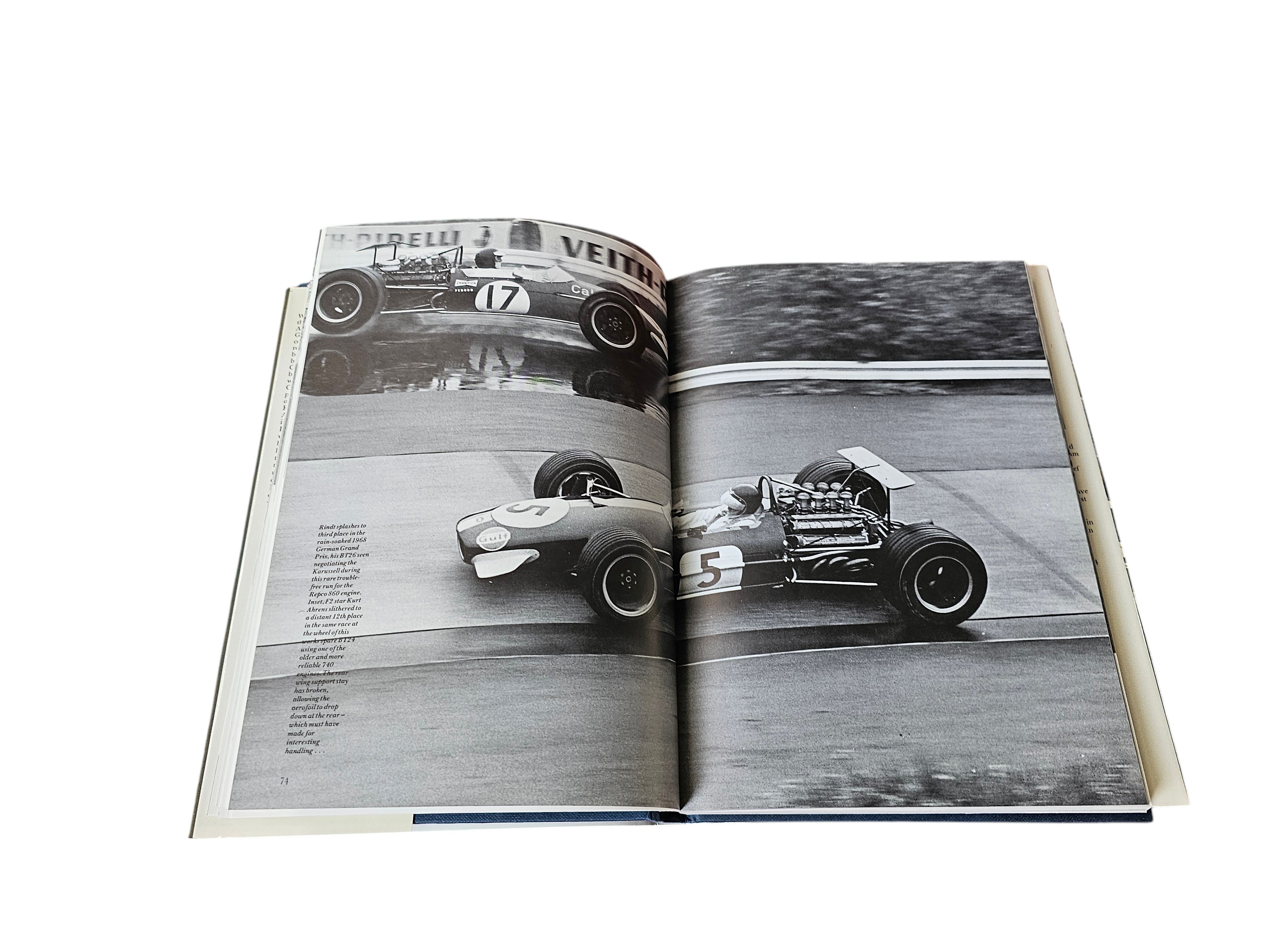 Brabham Grand Prix Cars book open with two vintage race car photographs