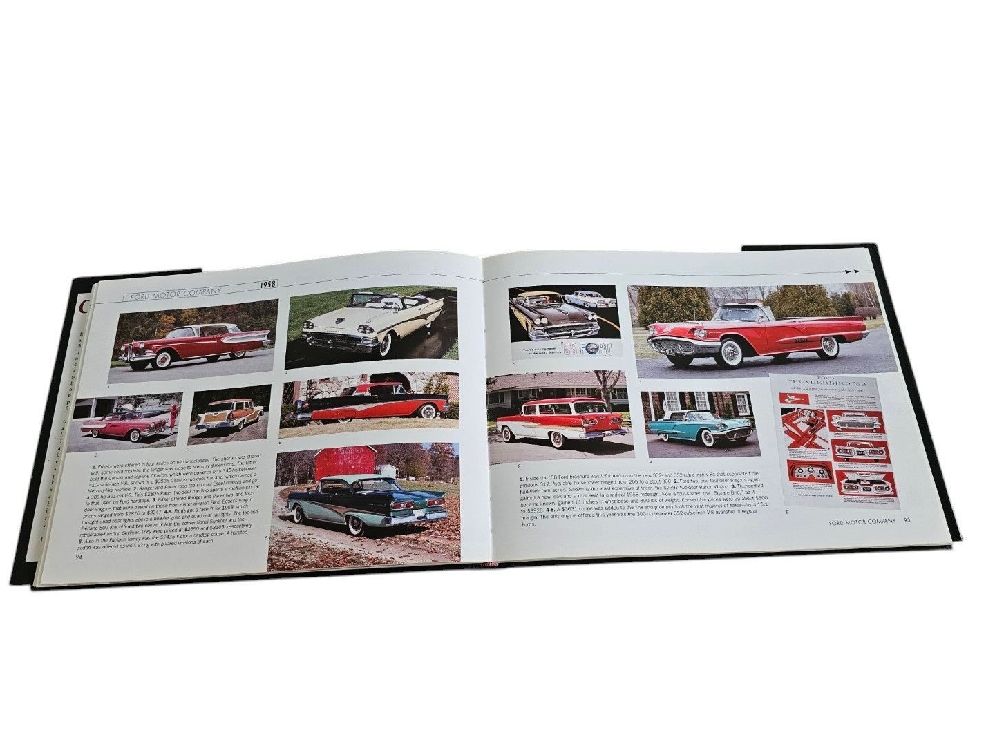 Automoto Bookshop Cars of the 1950's hardcover book open to a page featuring vintage Ford car photographs and history.