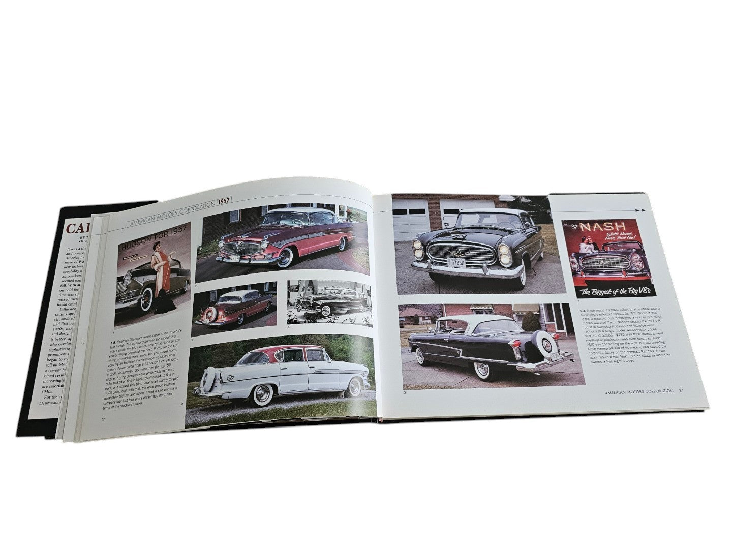 Automoto Bookshop Cars of the 1950's hardcover book open to pages showing vintage American cars and advertisements