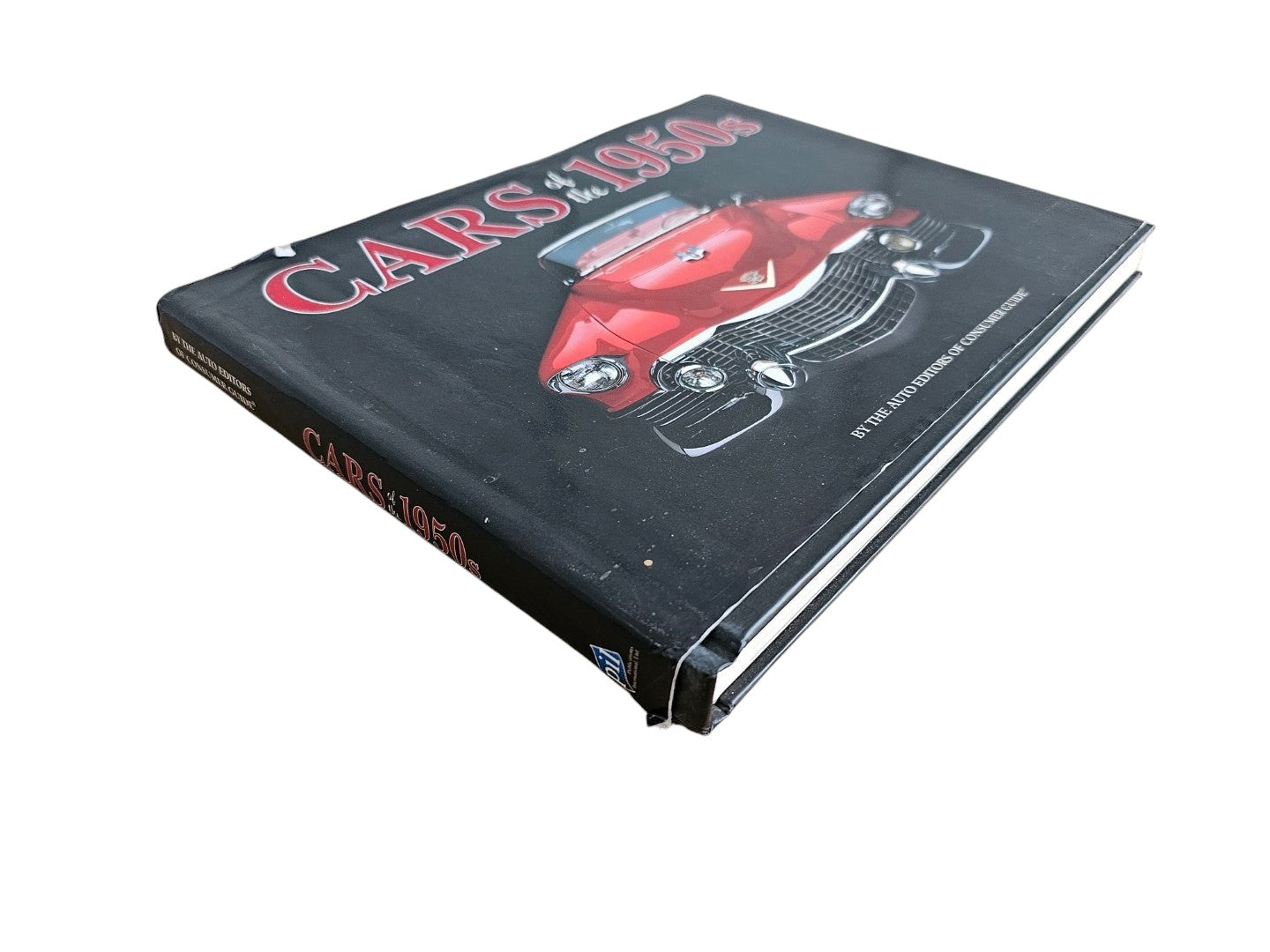 Automoto Bookshop hardcover book Cars of the 1950's featuring a red vintage car on the black cover