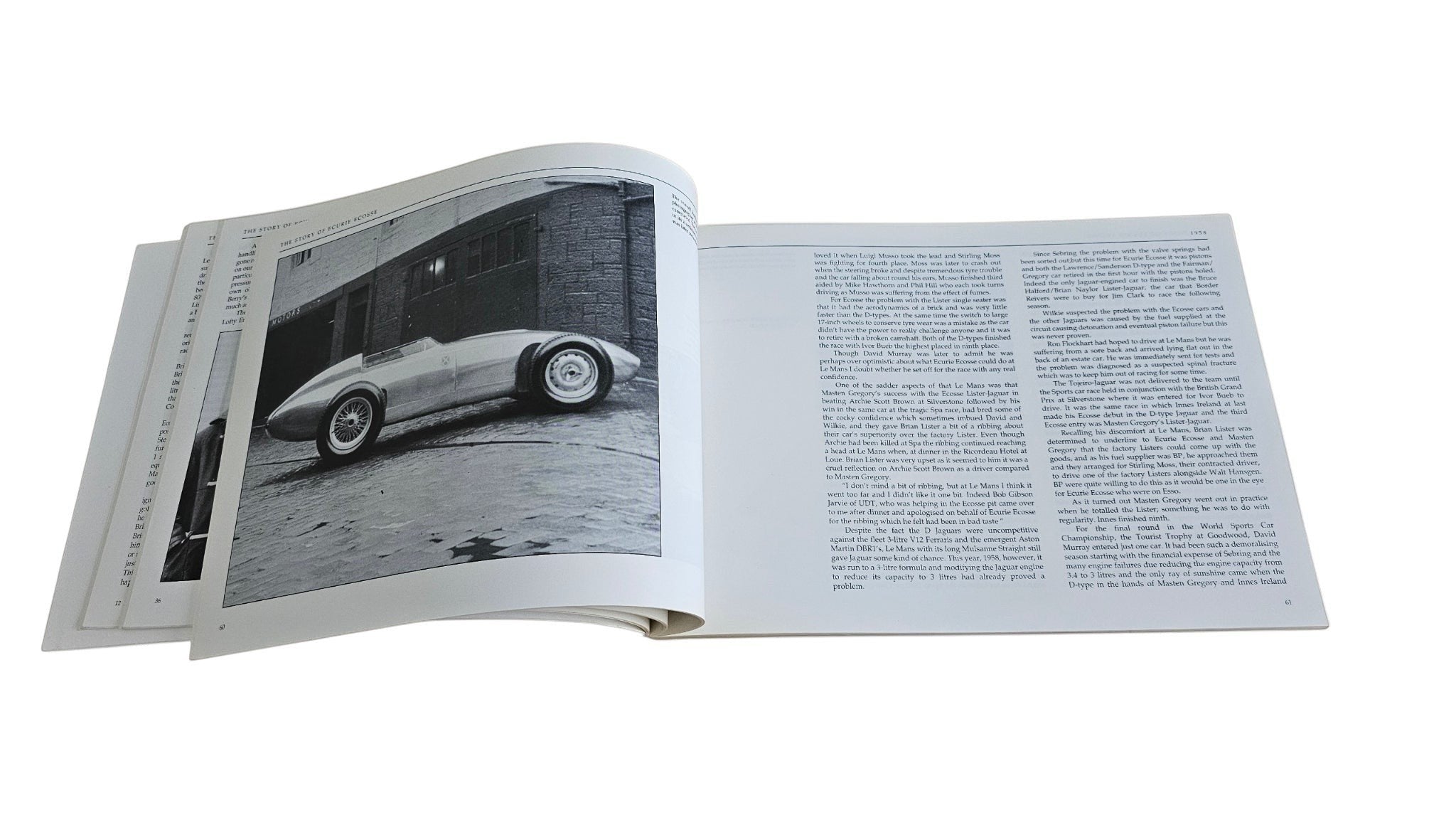 Ecurie Ecosse motorsport history book, open spread with race car photo and paragraphs.