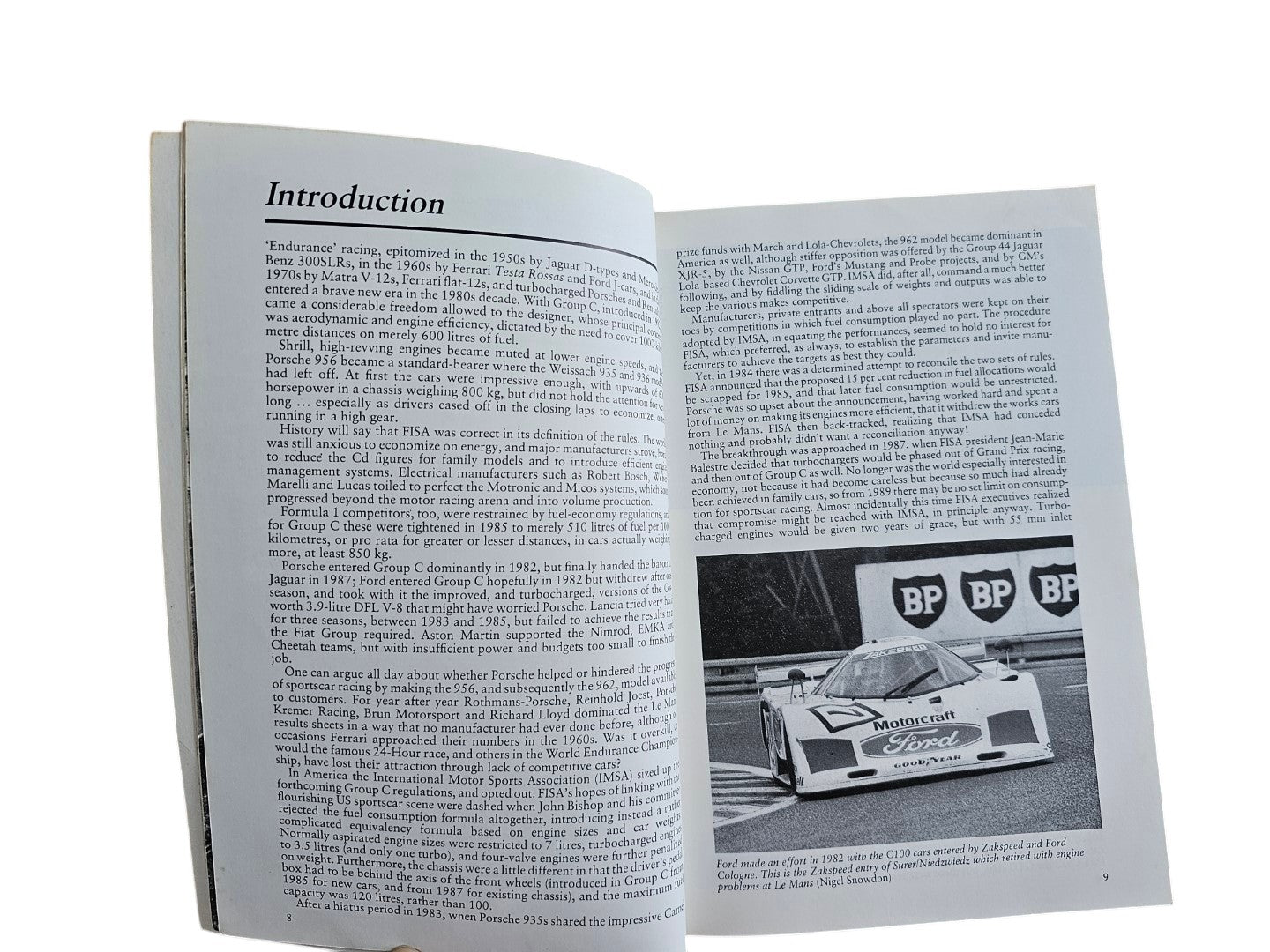 Automoto Bookshop paperback page showing text and a black and white photo of a 1982 Ford Group C race car.