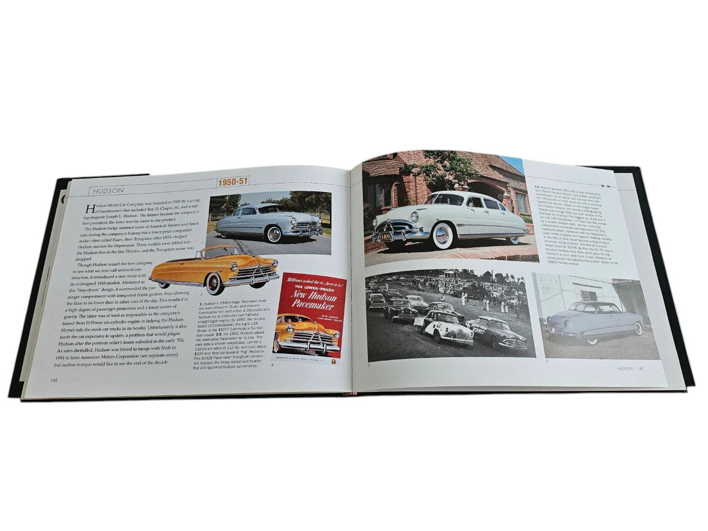 Automoto Bookshop hardcover book open to pages featuring vintage Hudson car photographs and historical text