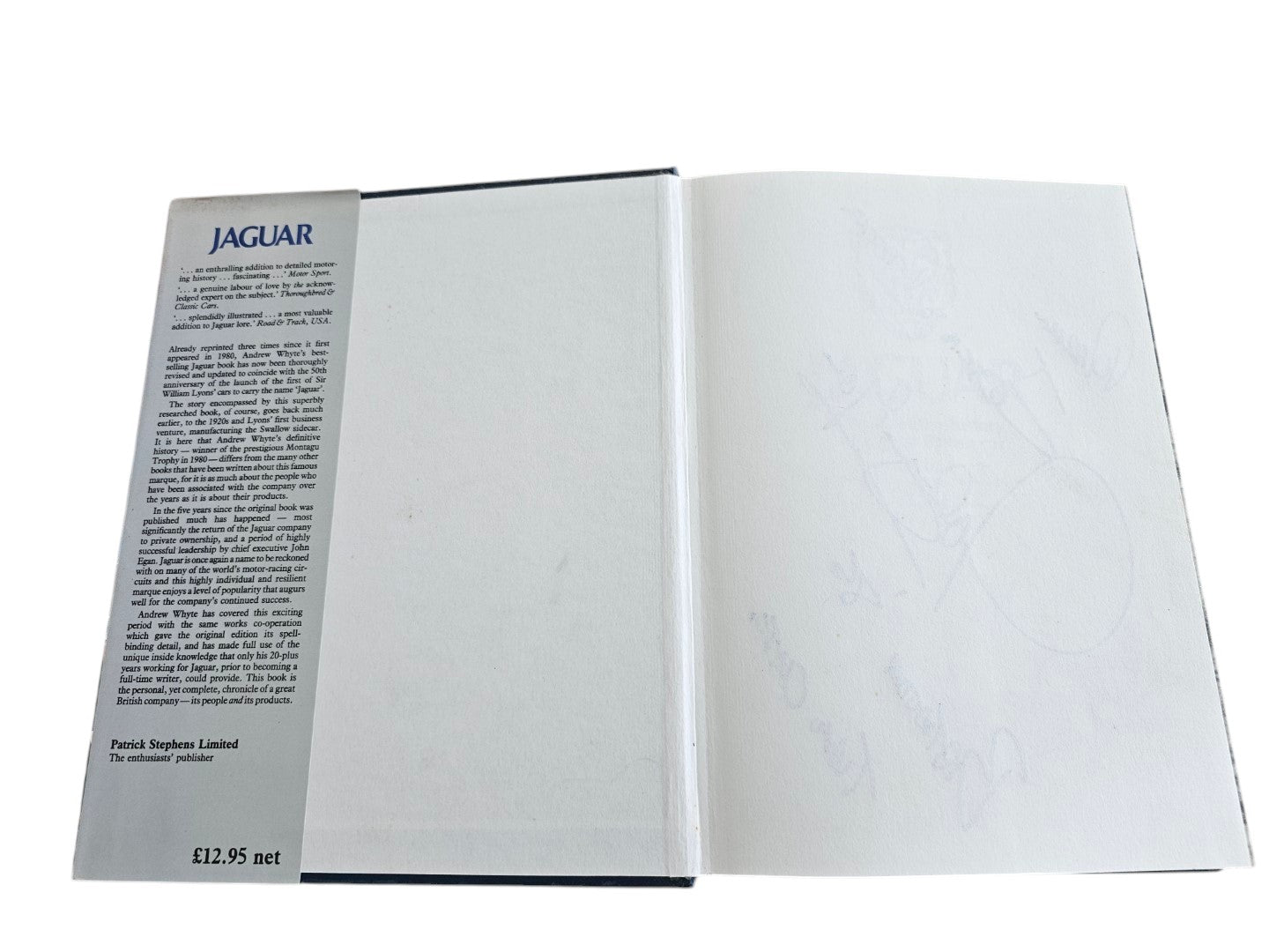 Automoto Bookshop signed copy of Jaguar The Definitive History by Andrew Whyte, showing the inside dust jacket flap.