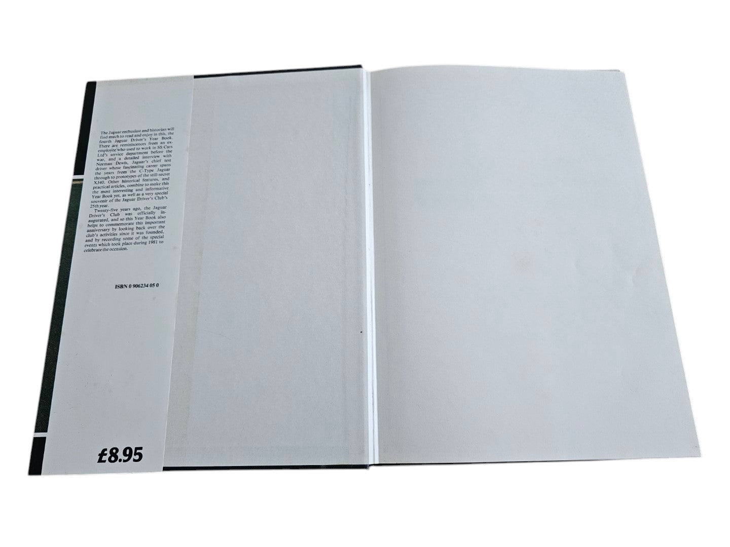 Open year book with small left text column and blank white right page