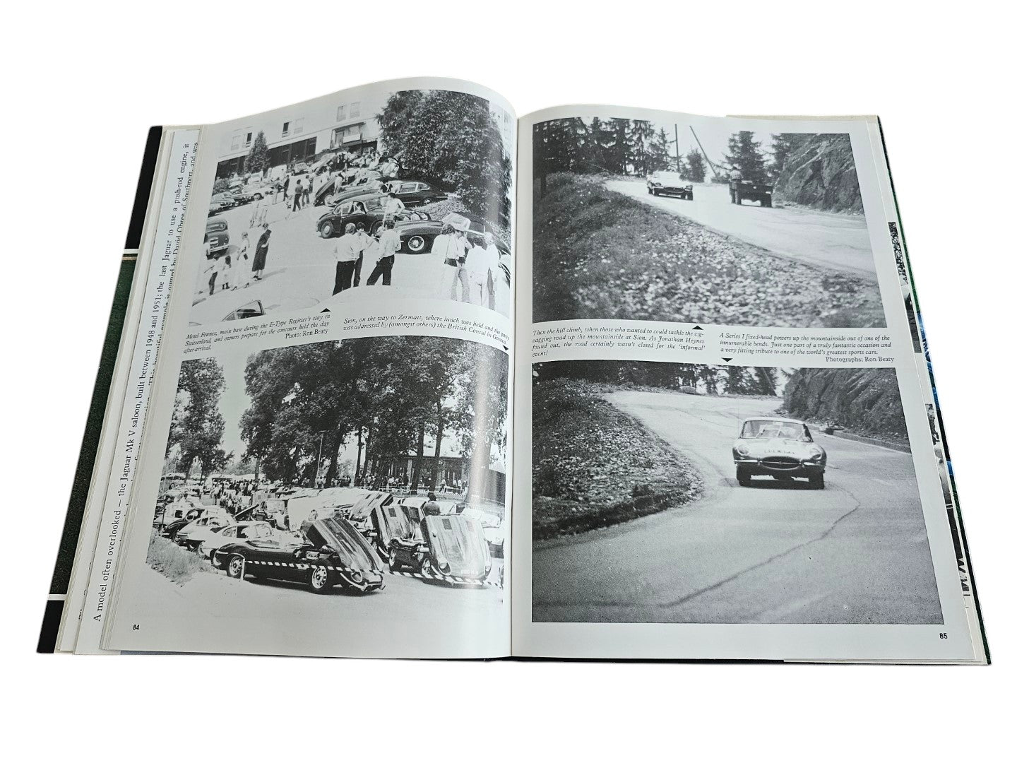 Jaguar year book (1980–81) open to classic car lineup and road course photo pages