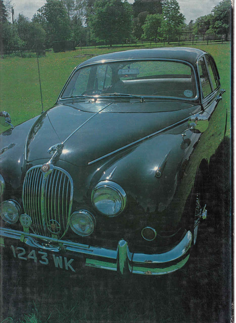 Classic Jaguar year book cover with dark green coupe on grass