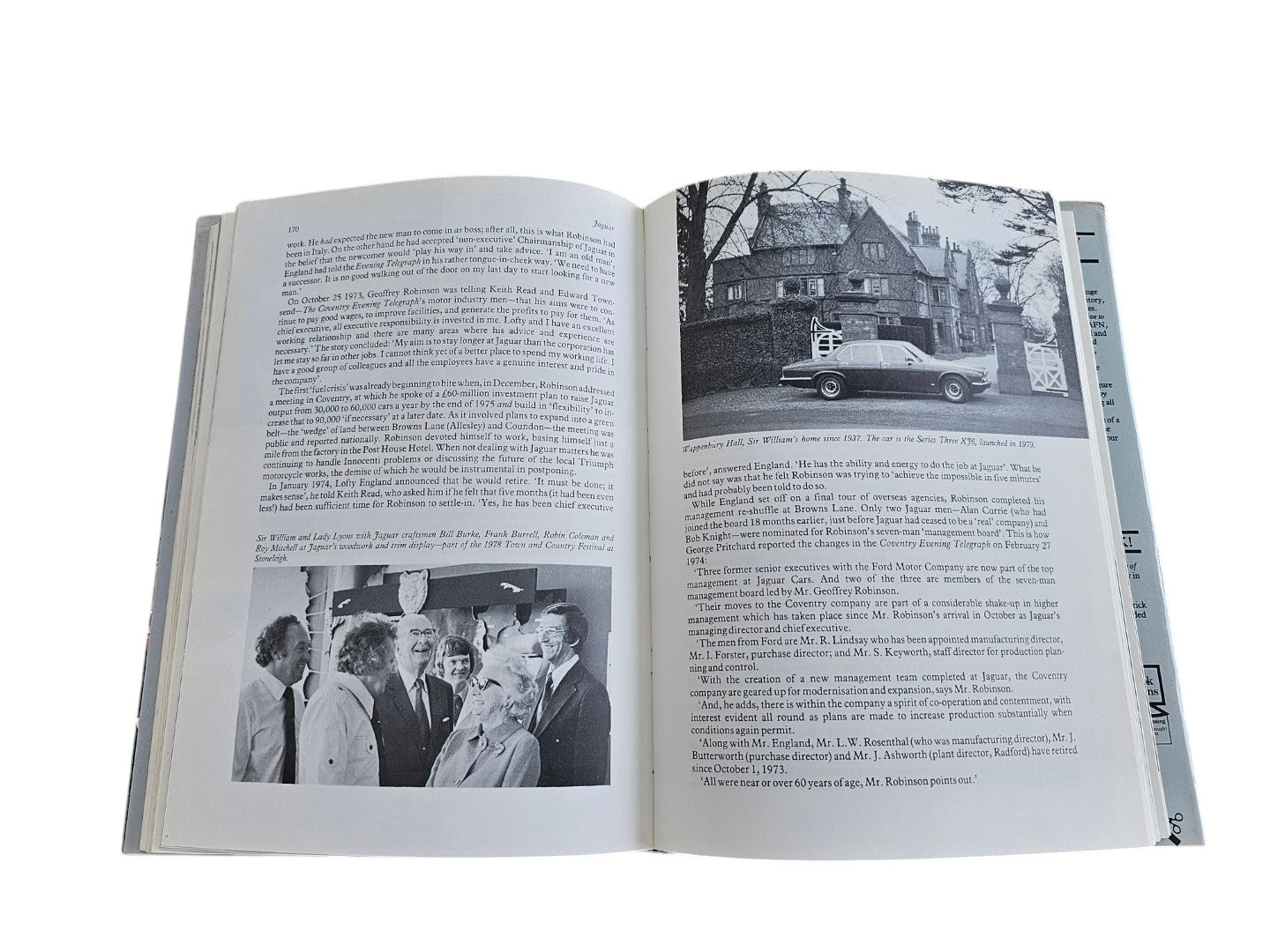 Open pages of Automoto Bookshop Jaguar The Definitive History book featuring black and white historical photographs.