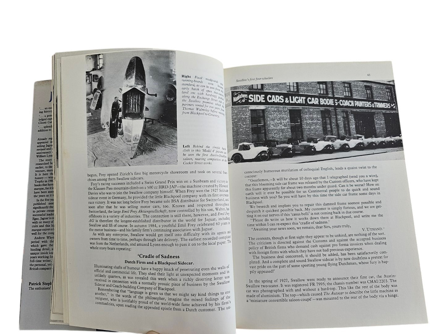 Automoto Bookshop vintage Jaguar history book open to pages showing black and white photos of early Swallow sidecars