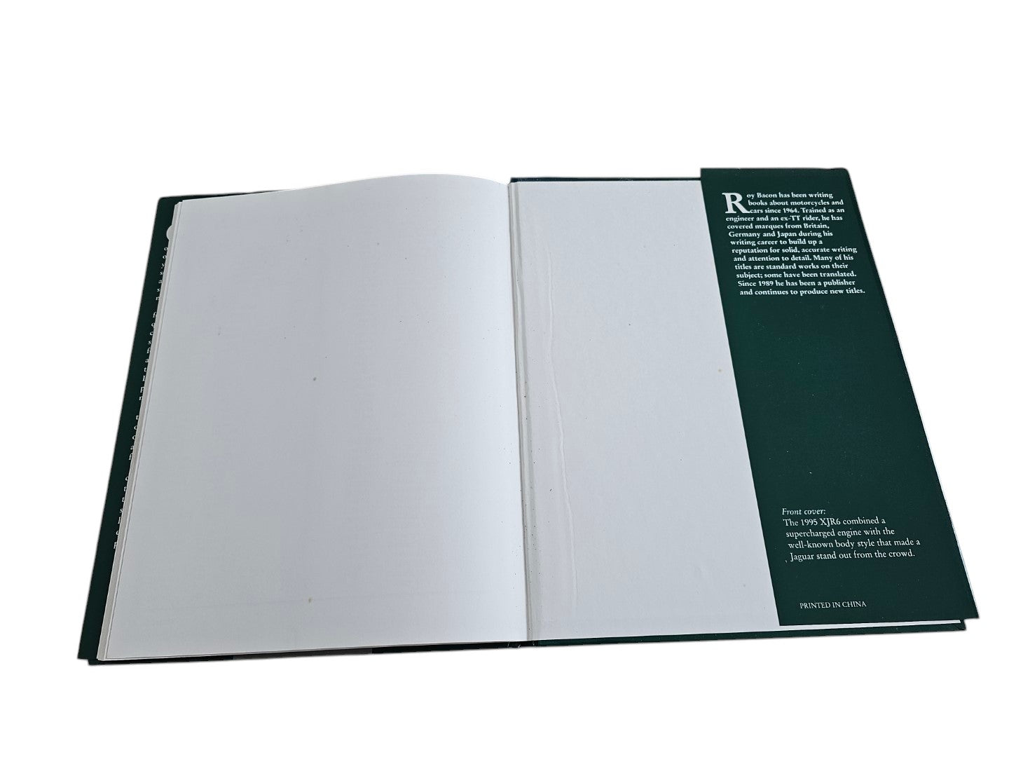 Open pages of Jaguar: The Illustrated Motorcar Legends by Roy Bacon, sold by Automoto Bookshop.