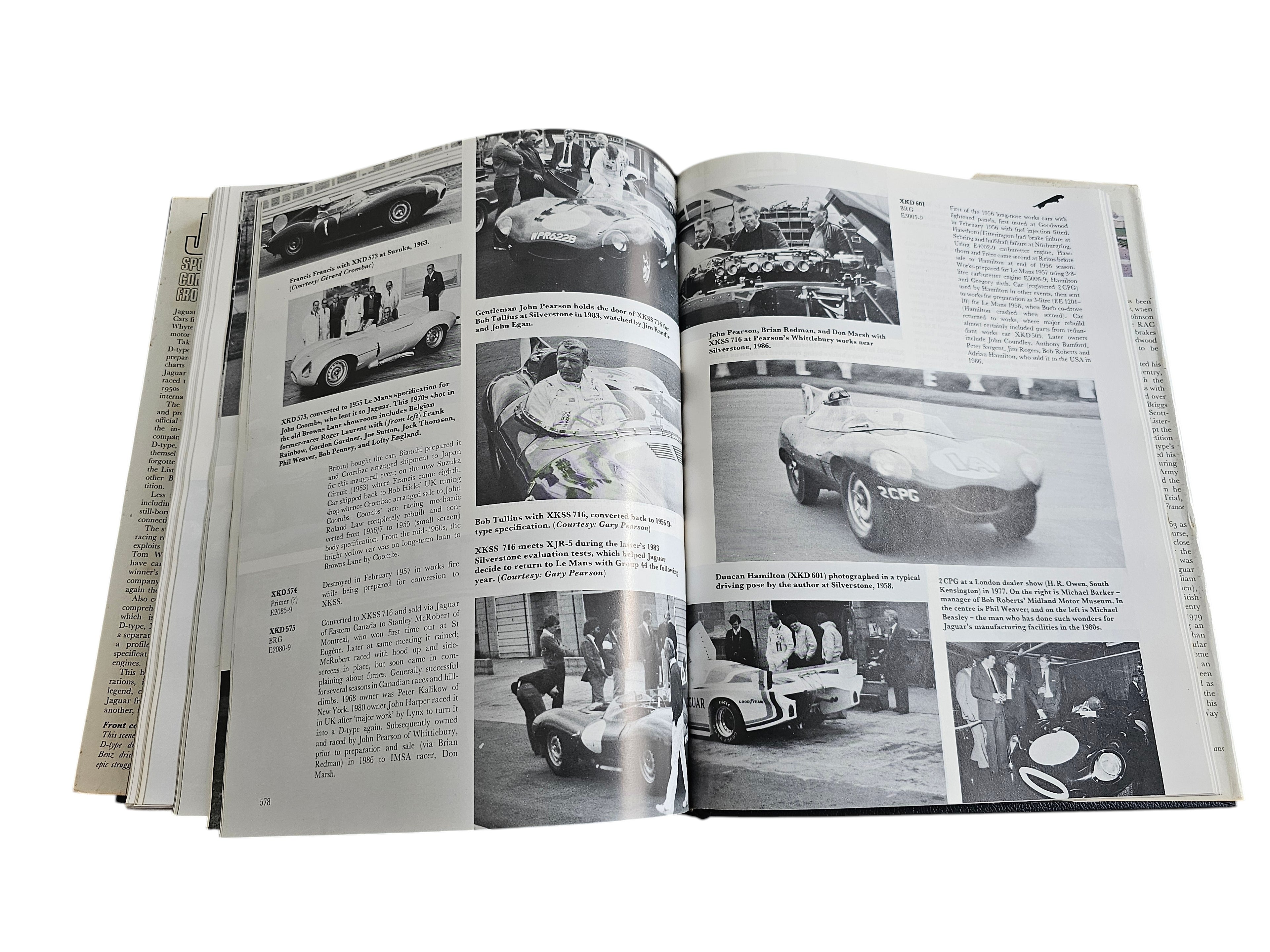 Automoto Bookshop vintage Jaguar sports racing car history book open to pages showing black and white racing photos
