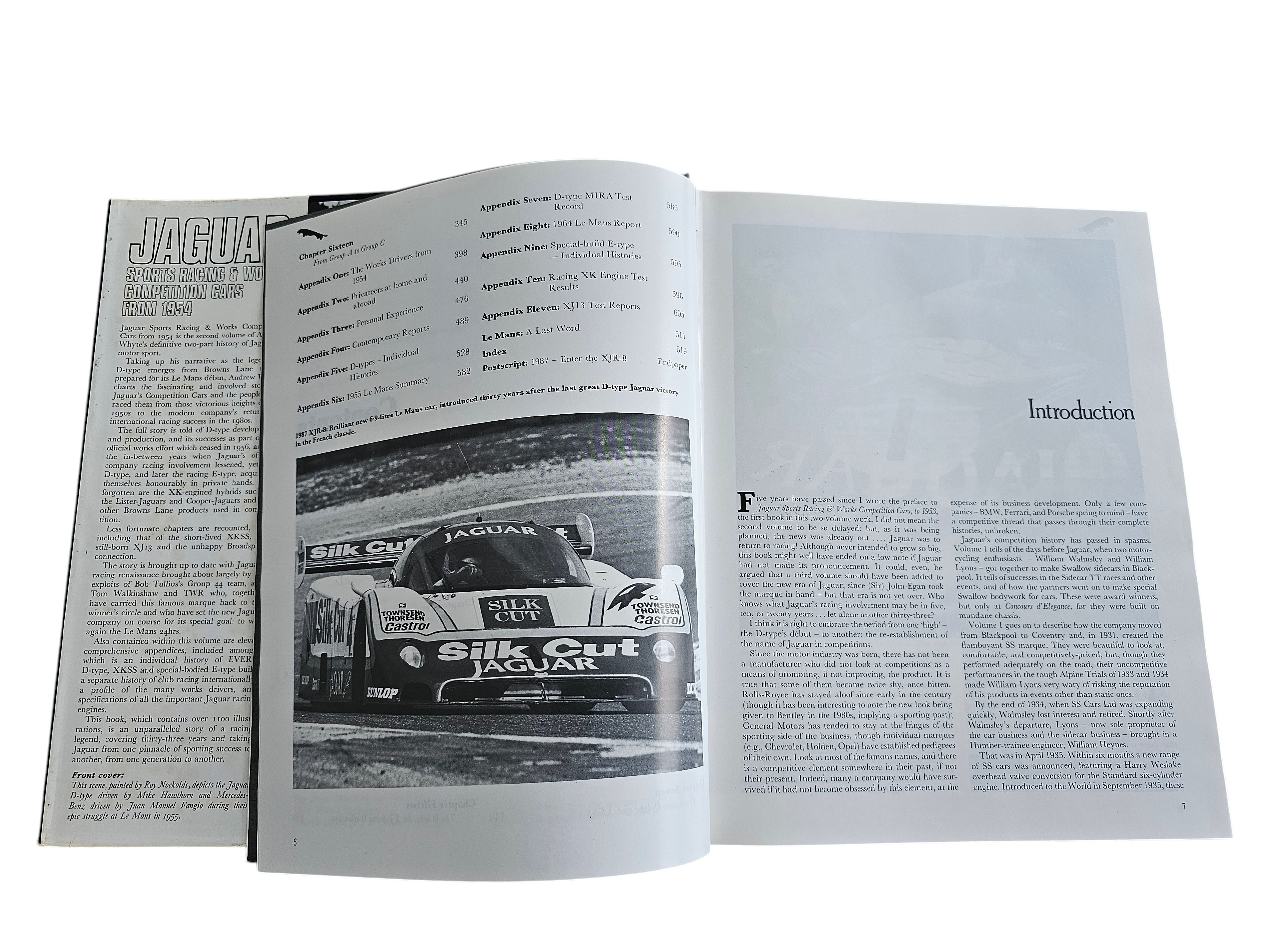 Automoto Bookshop vintage Jaguar sports racing car history book open to pages showing text and a Silk Cut race car