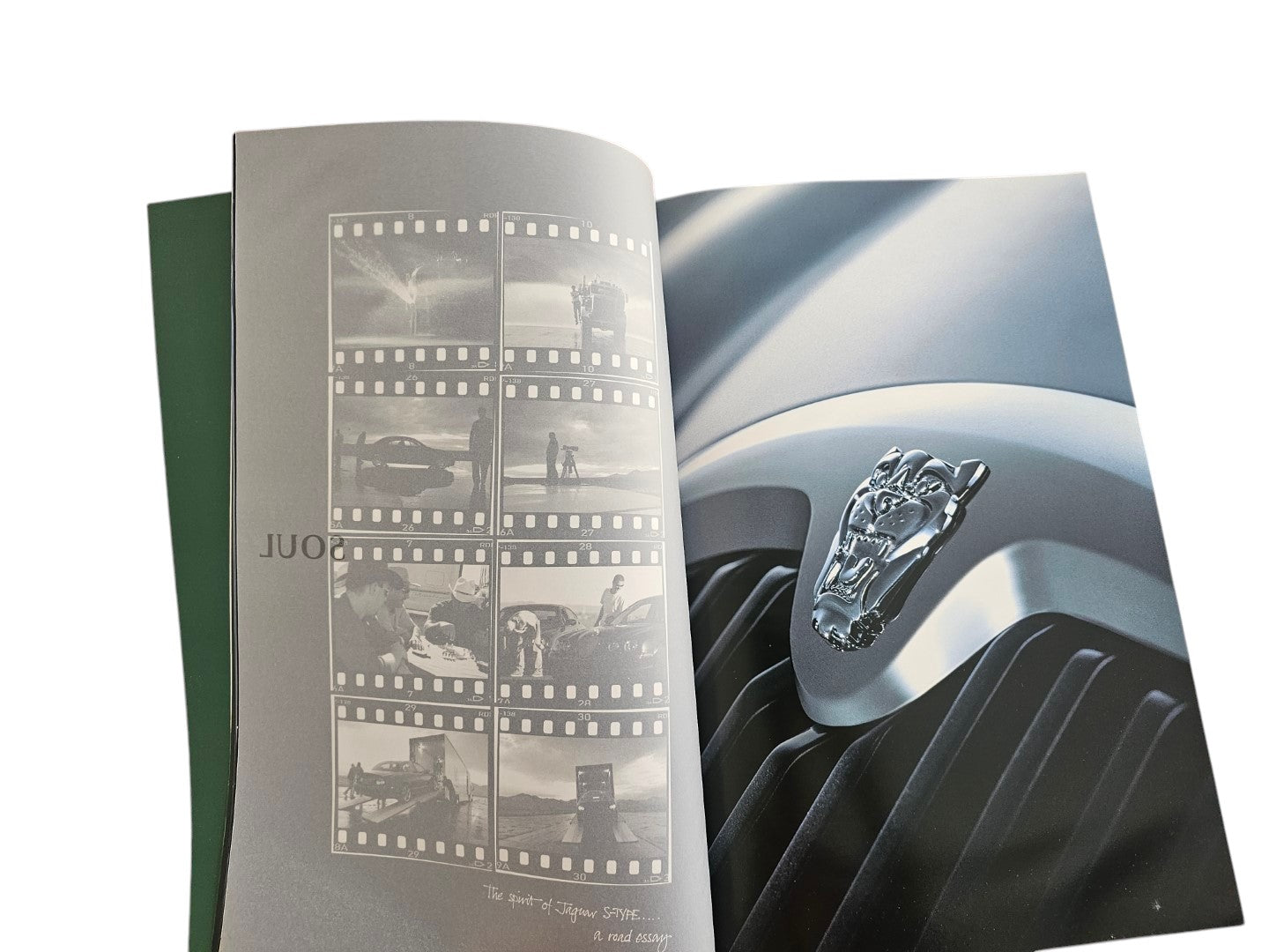 Automoto Bookshop 2002 Jaguar S-Type sales brochure featuring a chrome leaper hood ornament and film strip photography.