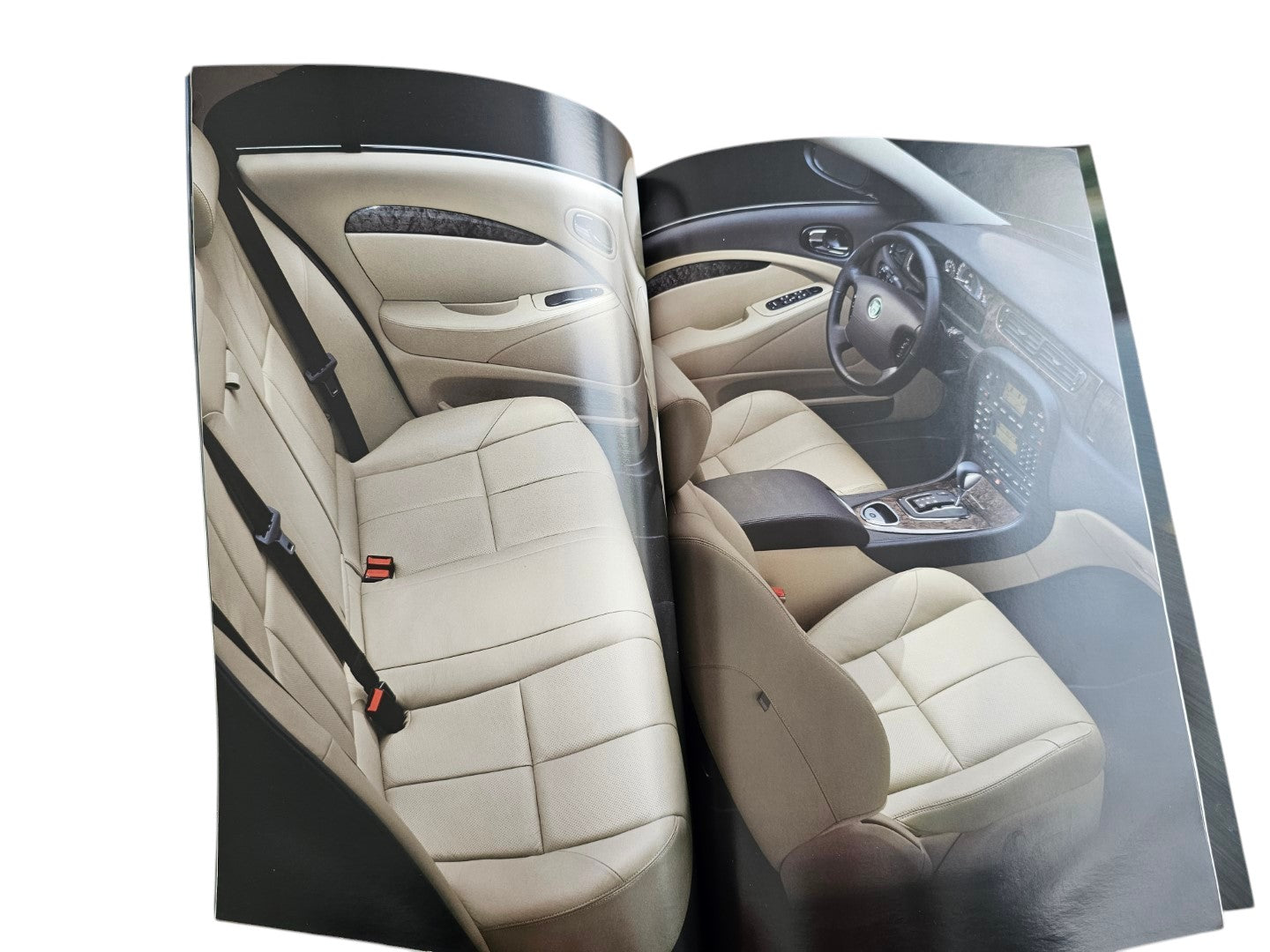 Automoto Bookshop 2002 Jaguar S-Type sales brochure showing the luxury beige leather interior and dashboard details.