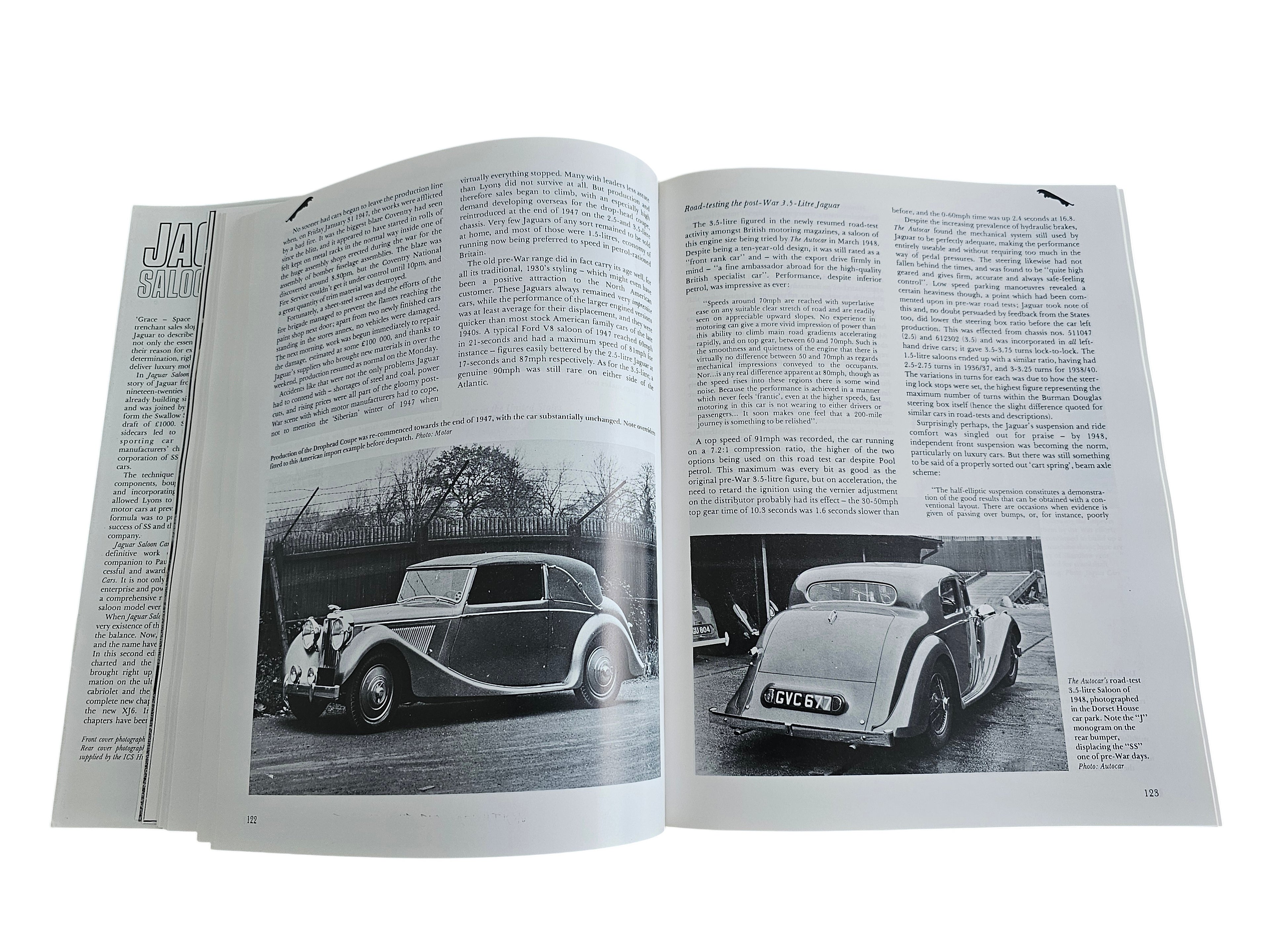 Open pages of Automoto Bookshop Jaguar Saloon Cars book featuring historical black and white photos of classic Jaguars
