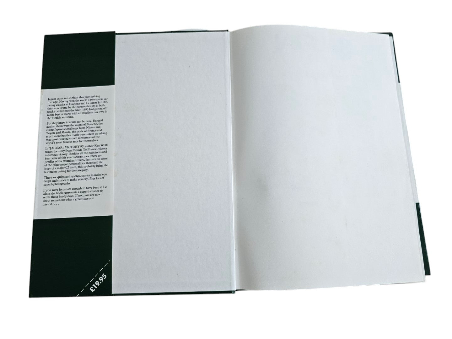 Automoto Bookshop hardcover copy of Jaguar Victory '90 by Ken Wells, showing the inner dust jacket flap text.
