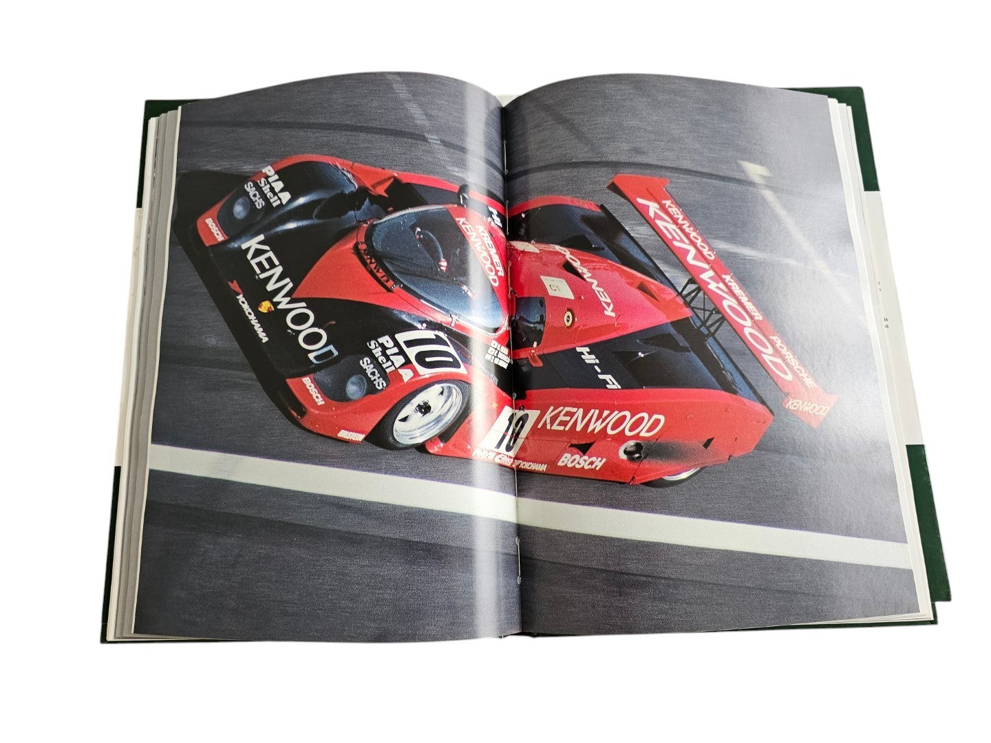 Automoto Bookshop hardcover book showing a red and black Kenwood Porsche race car on a track in Jaguar Victory '90