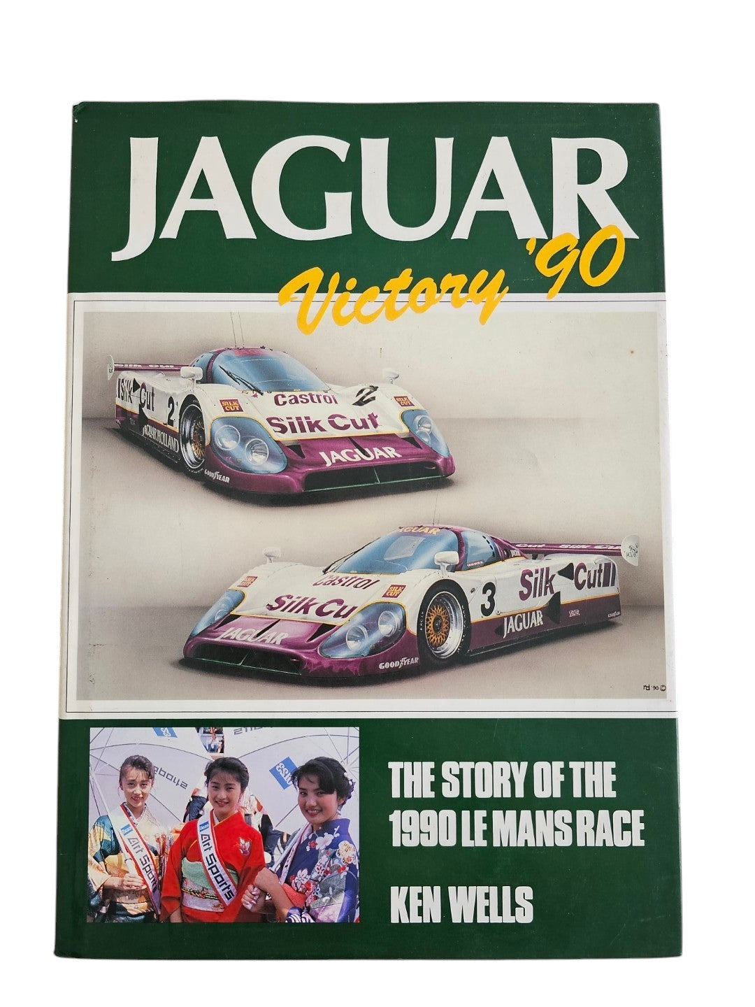Automoto Bookshop hardcover copy of Jaguar Victory '90 by Ken Wells, featuring Silk Cut Jaguar Le Mans race cars.