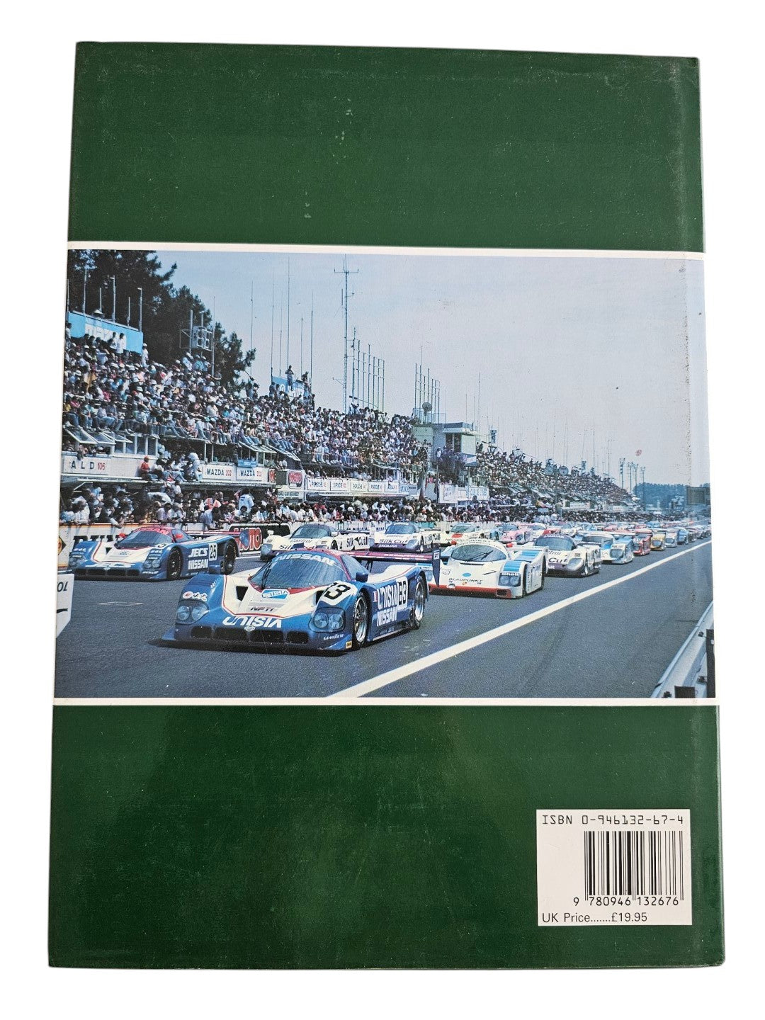 Automoto Bookshop hardcover copy of Jaguar Victory '90 featuring a Le Mans race scene on the dark green dust jacket.