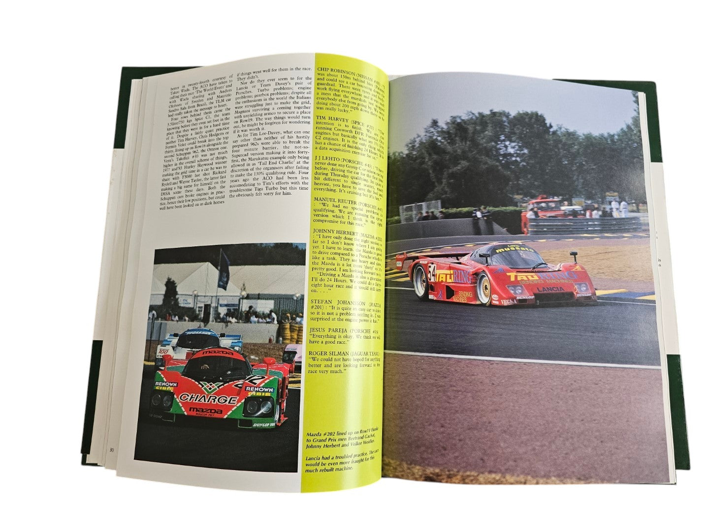 Open pages of Automoto Bookshop Jaguar Victory '90 hardcover book featuring vintage Le Mans race car photography