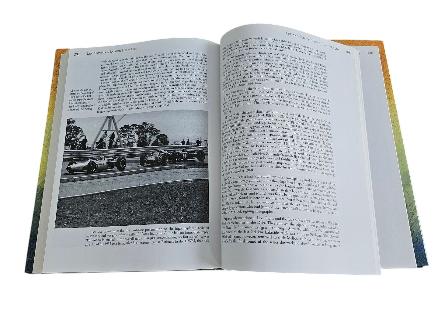 Automoto Bookshop rare biography Lex Davison Larger than Life open to a page featuring vintage racing car photography