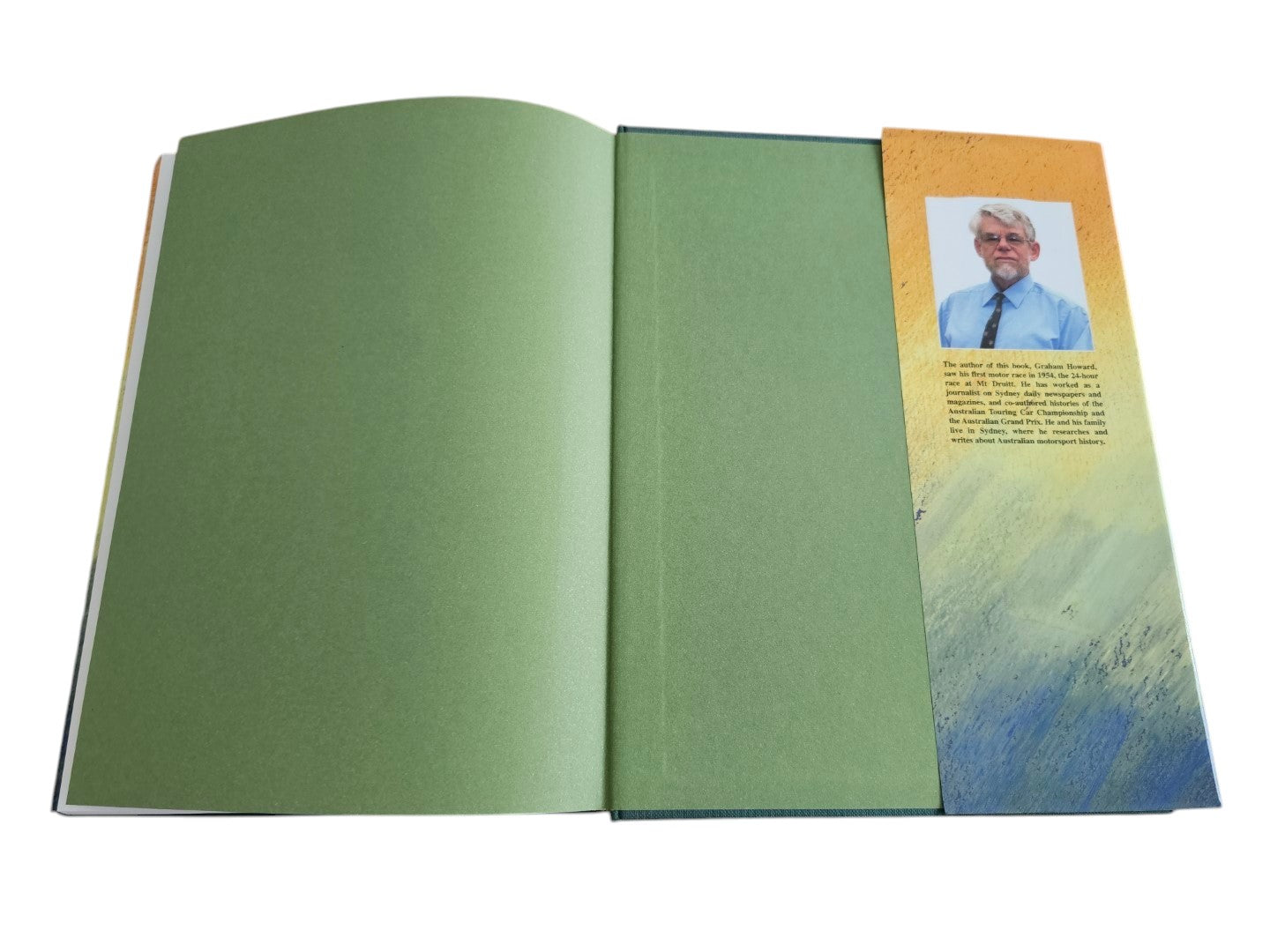 Automoto Bookshop rare biography Lex Davison Larger than Life, open hardcover book with green endpapers and author bio