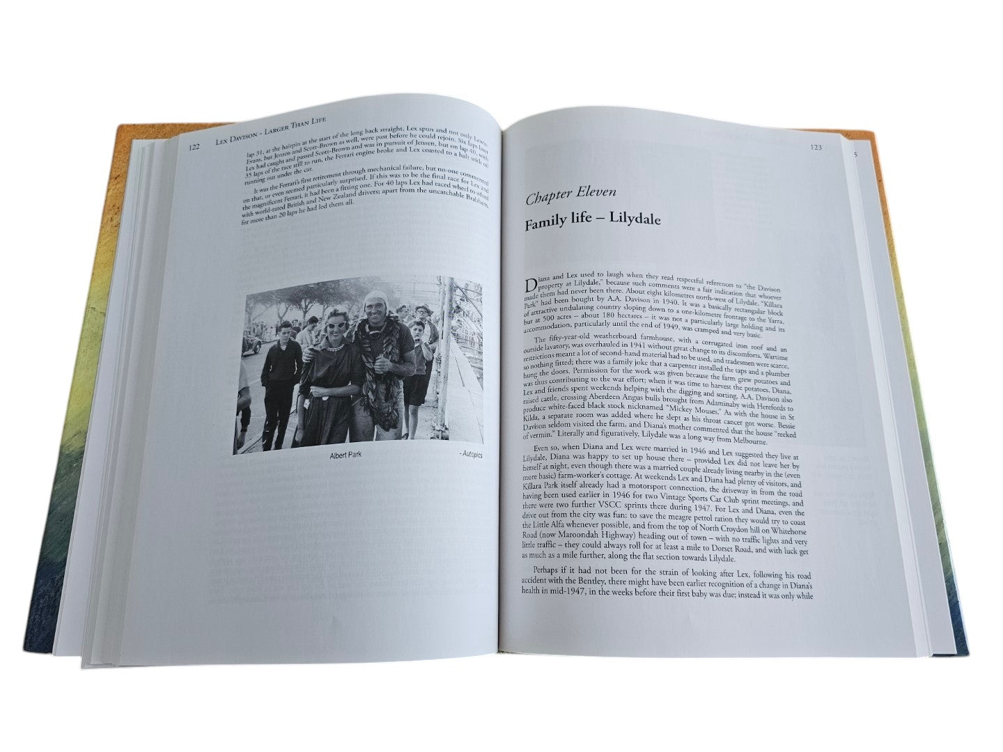 Open pages of Automoto Bookshop biography Lex Davison - Larger than Life featuring text and a vintage racing photo