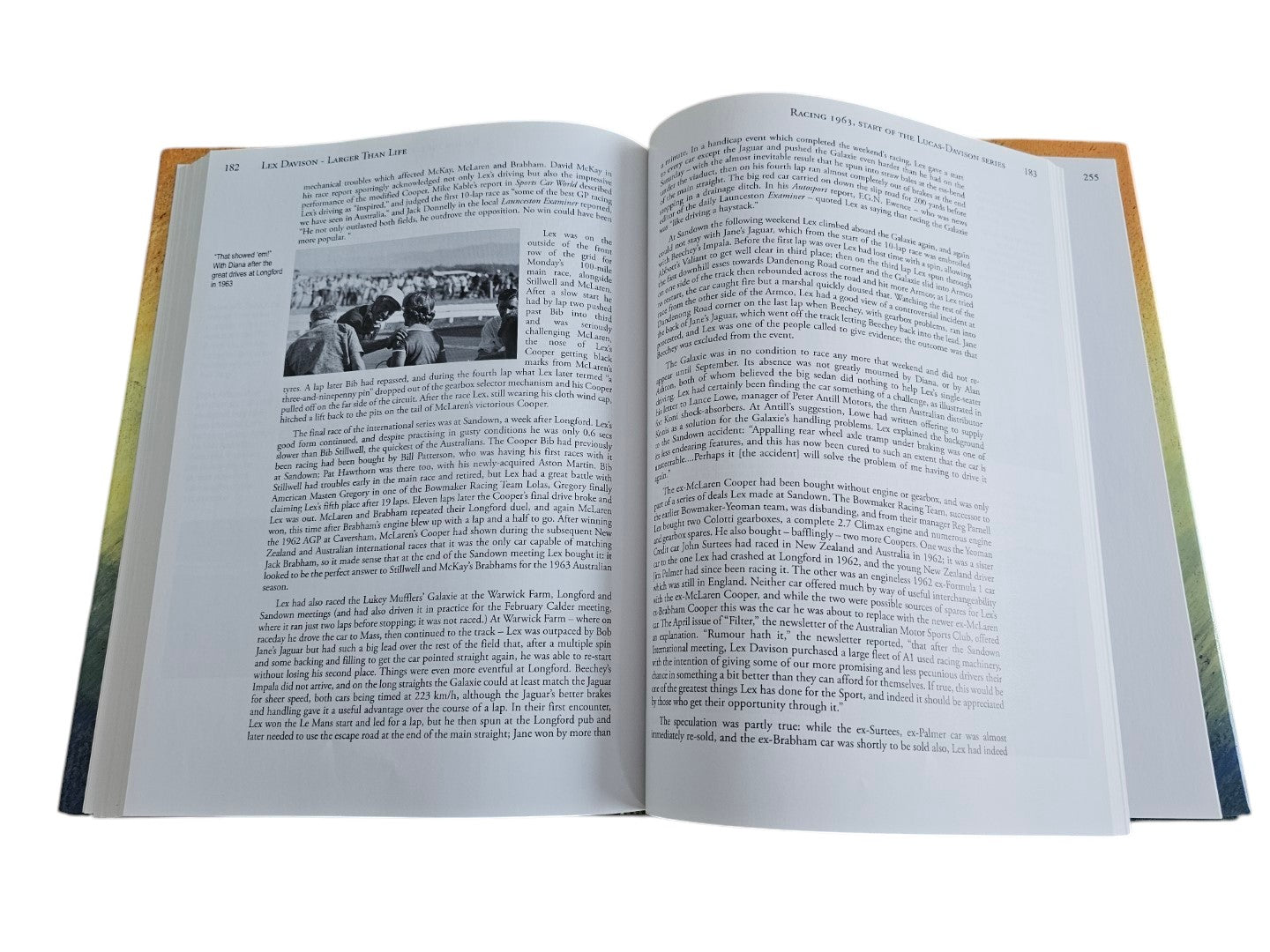 Open pages of Automoto Bookshop Lex Davison biography featuring historical racing text and a black and white photo