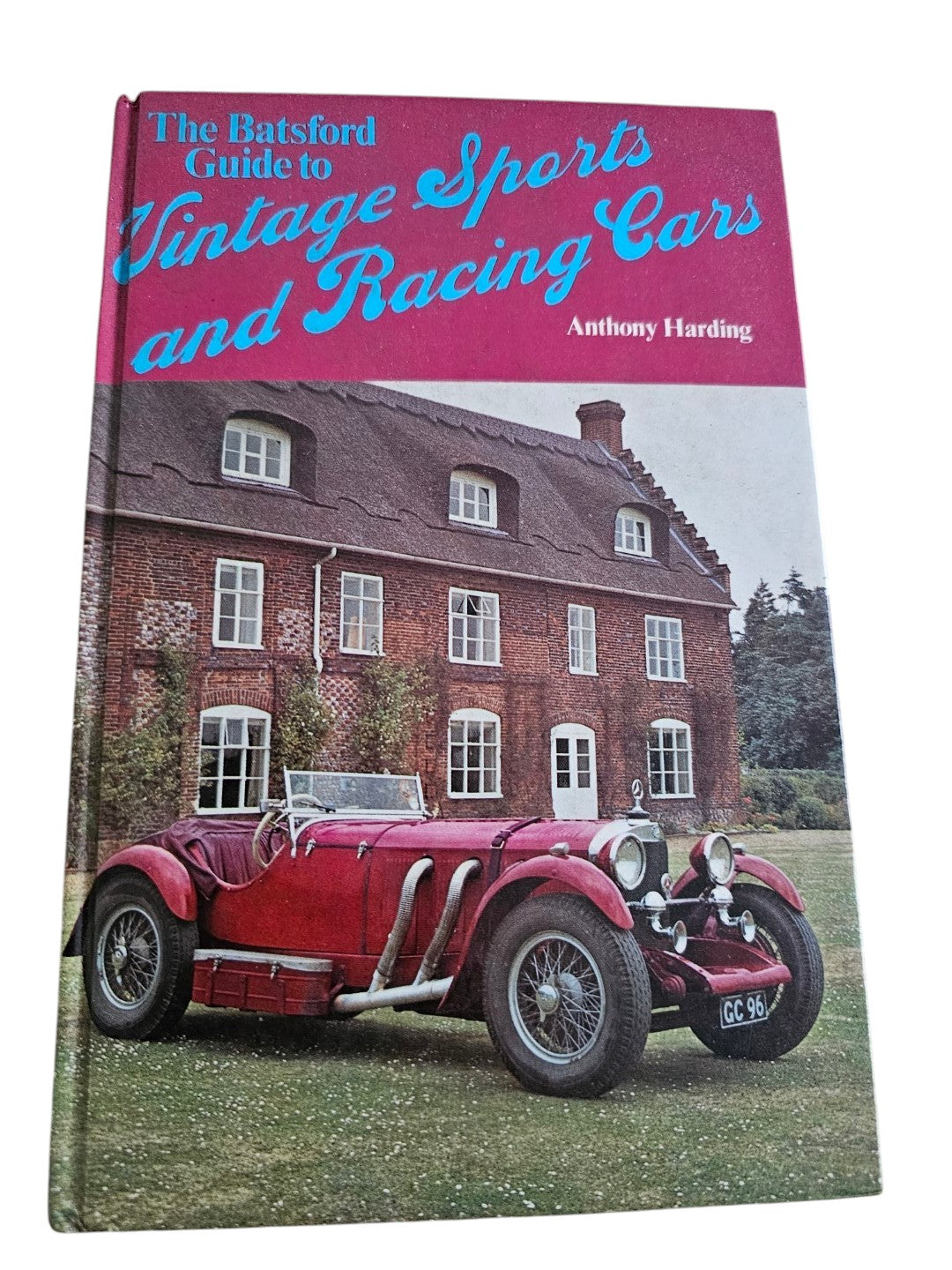 Automoto Bookshop vintage sports and racing cars guide by Anthony Harding, featuring a red classic car on the cover.