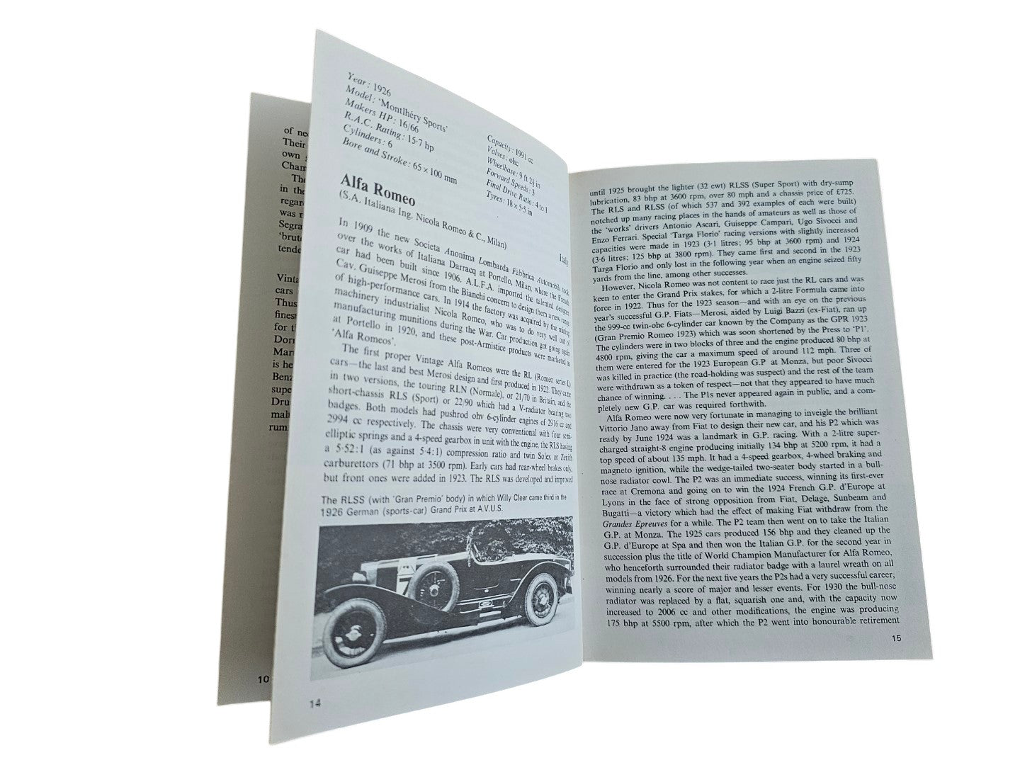 Automoto Bookshop vintage sports car guide open to the Alfa Romeo page with historical text and a black-and-white photo