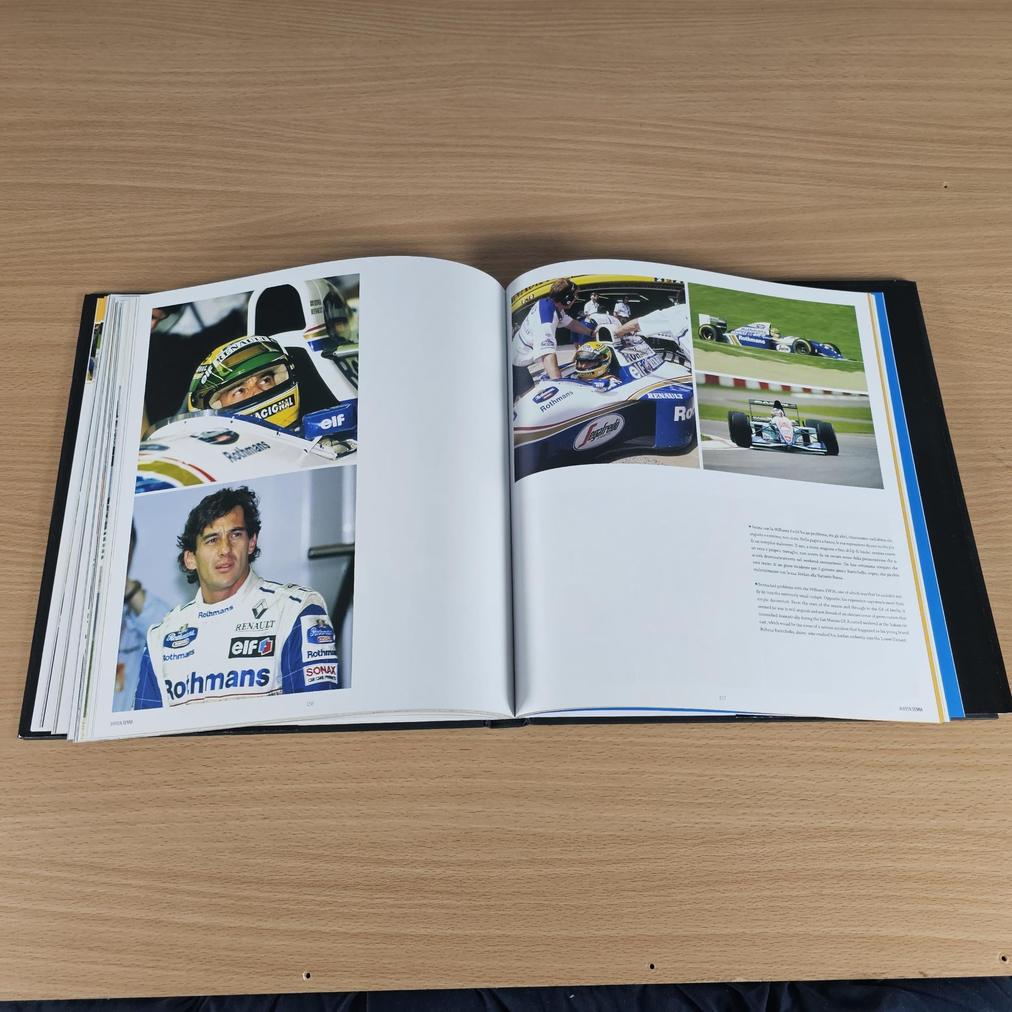 Open hardcover photo book with racing driver portraits and printed text pages