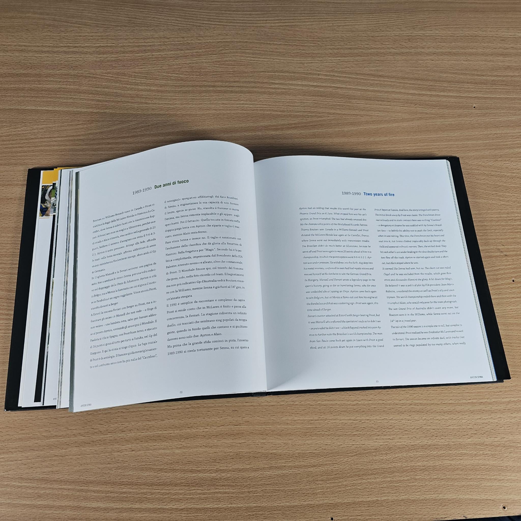 Open hardcover book spread with narrow photo strip along the page edge and text.