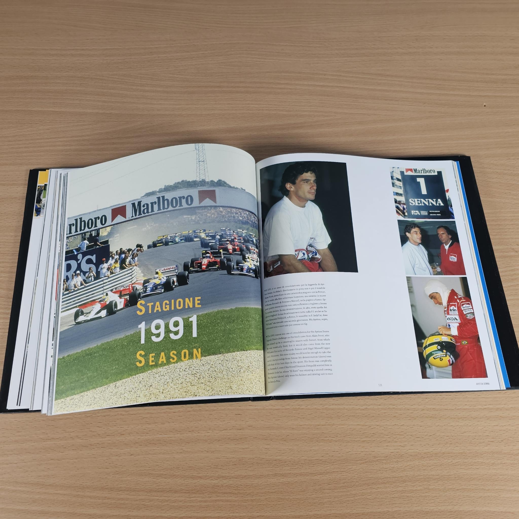 Open hardcover book spread with "Stagione 1991 Season" graphic and Senna portraits.