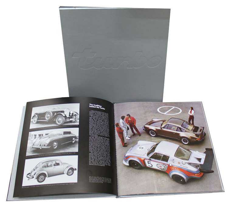 Car tribute book with gray slipcase and open pages of race car photos