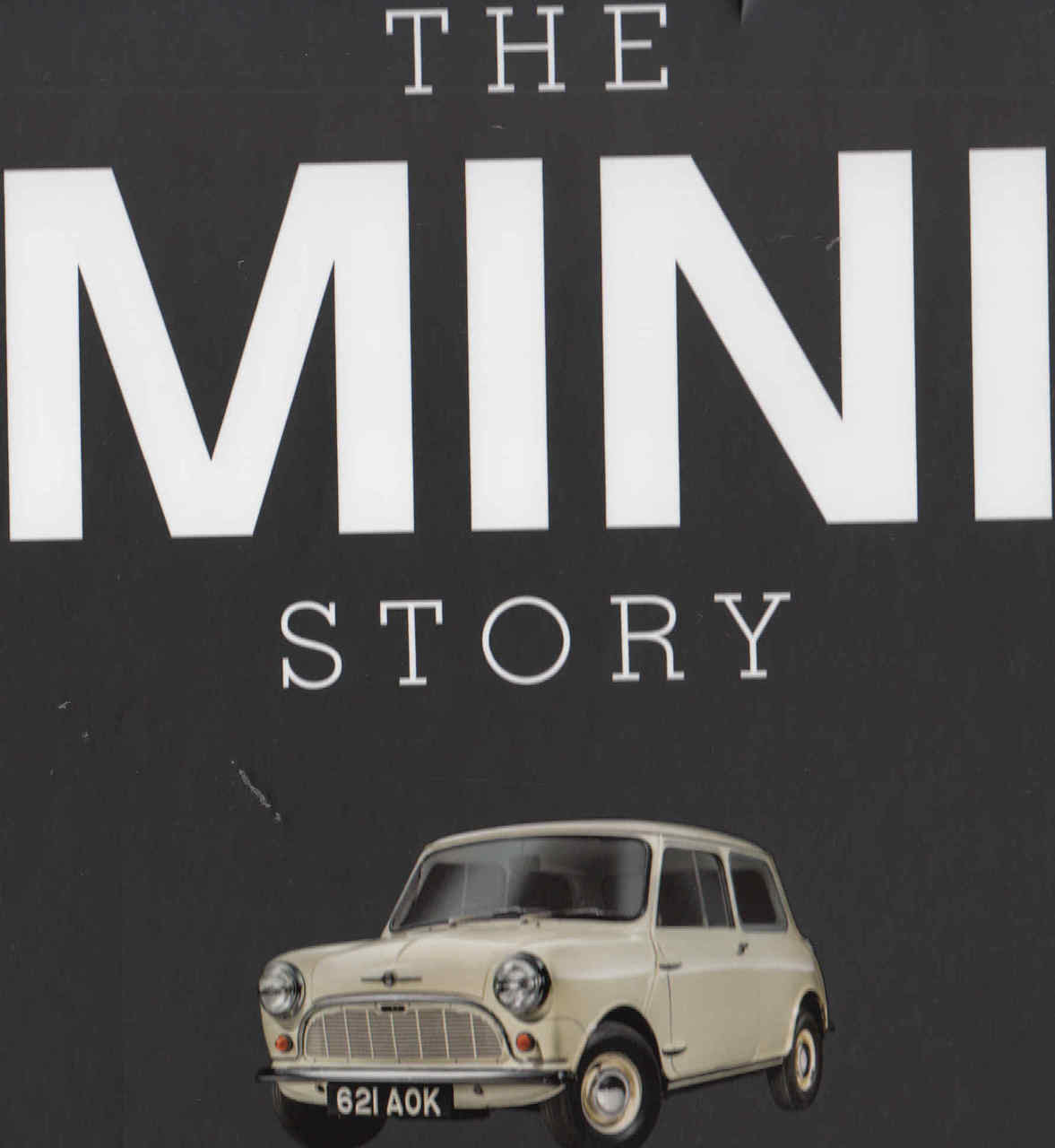 Classic car book cover close-up, large THE MINI STORY title and cream Mini