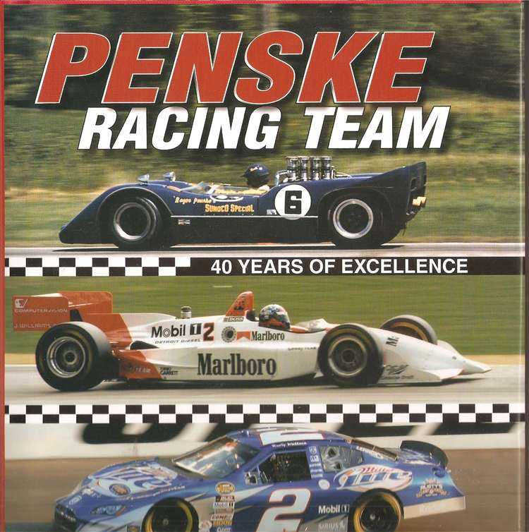 Racing team book cover with two vintage race cars and checkered stripes
