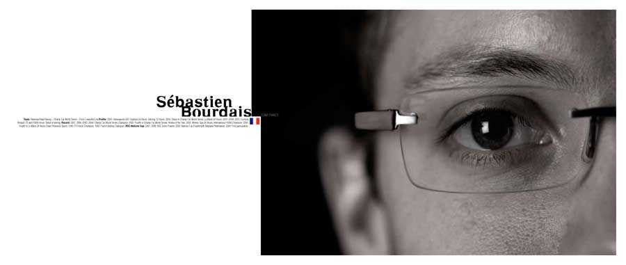 Signed photo book open to close-up portrait with eyeglasses