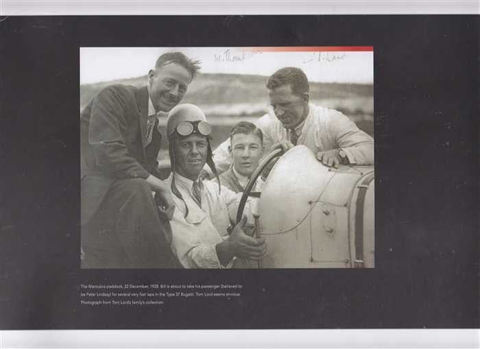Signed racing book page with vintage photo of drivers beside race car