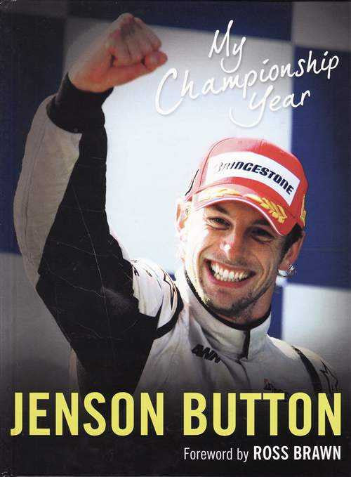 Motorsport autobiography book cover with smiling driver, fist up, and Jenson Button text