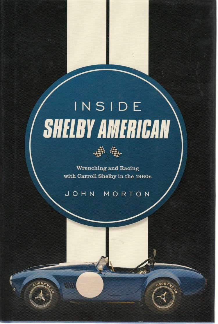 Hardcover book cover with blue circular logo and white lettering, plus car image