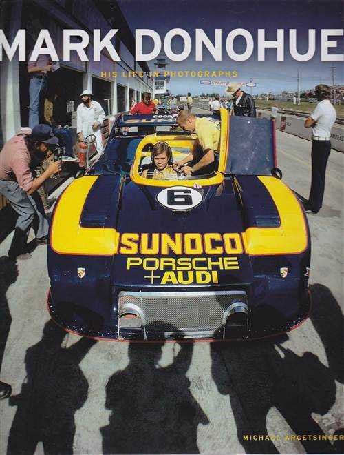 Mark Donohue photo biography book cover with yellow race car and title text