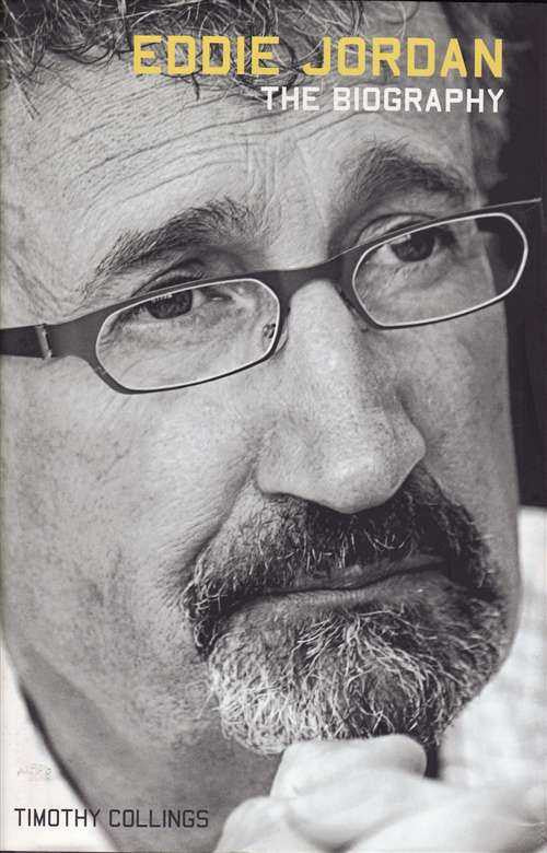 Biography book cover with close-up portrait of man wearing glasses