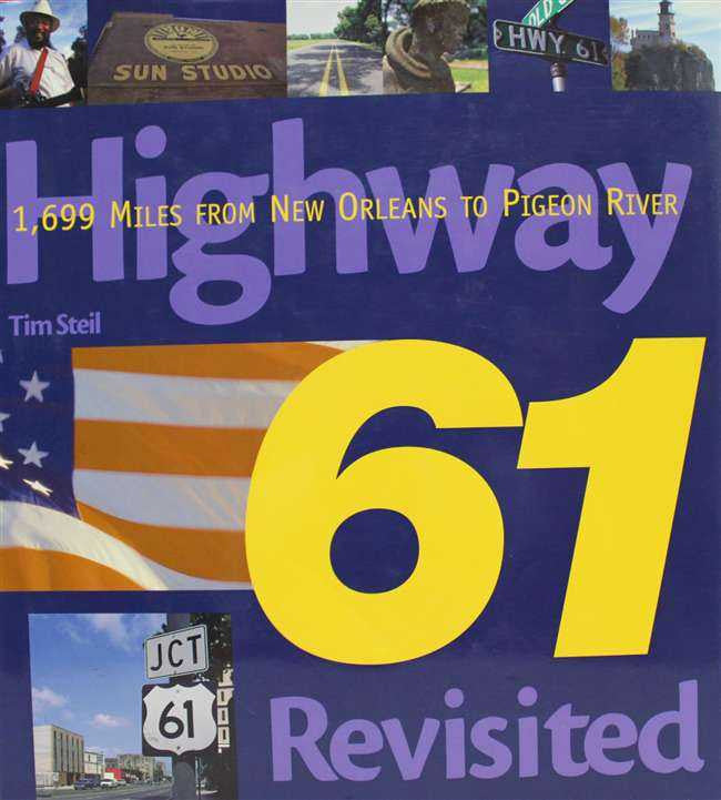 Book front cover with large yellow 61, "Revisited" text, and star-spangled banner