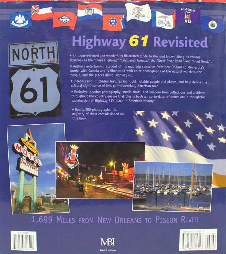 Blue book cover with route map icons, star-spangled banner, and 1,699 Miles text