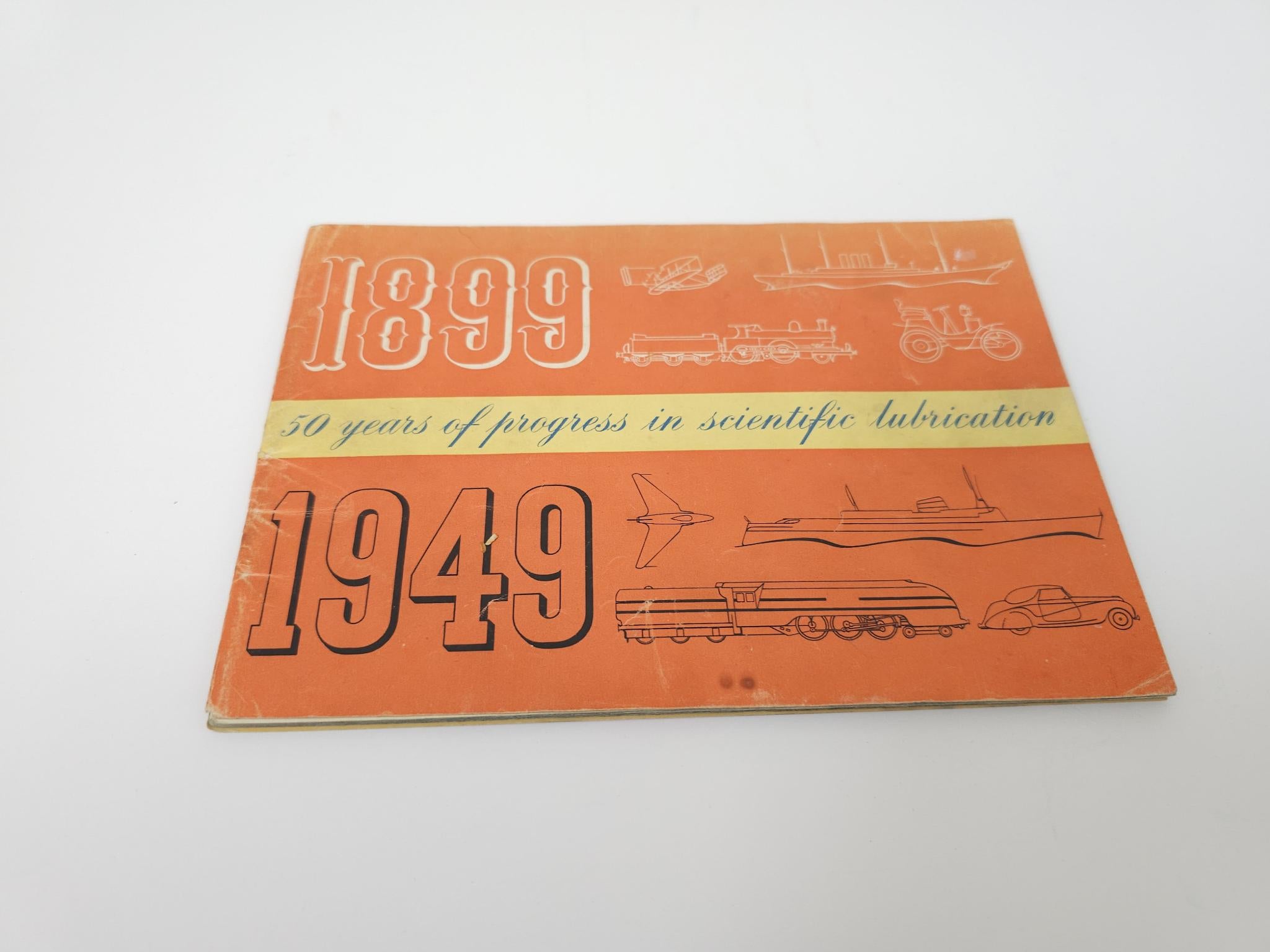 Orange vintage paperback cover showing 1899 and 1949 with rail, bike, and engine drawings