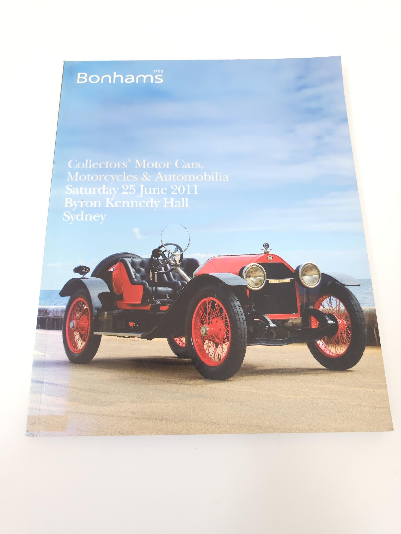 Auction catalogue book with classic motorcycle on cover and Bonhams text at the top