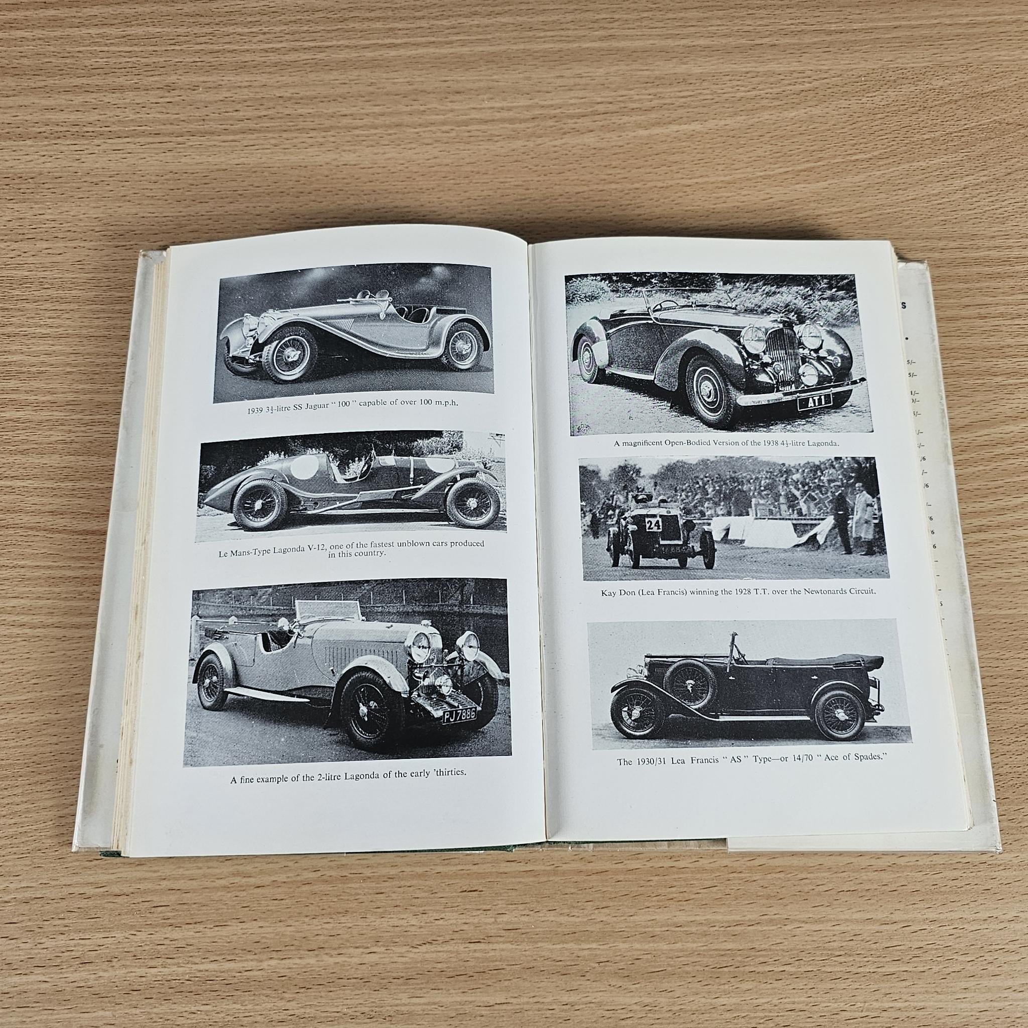 Open book spread with black-and-white vintage sports car photos and captions