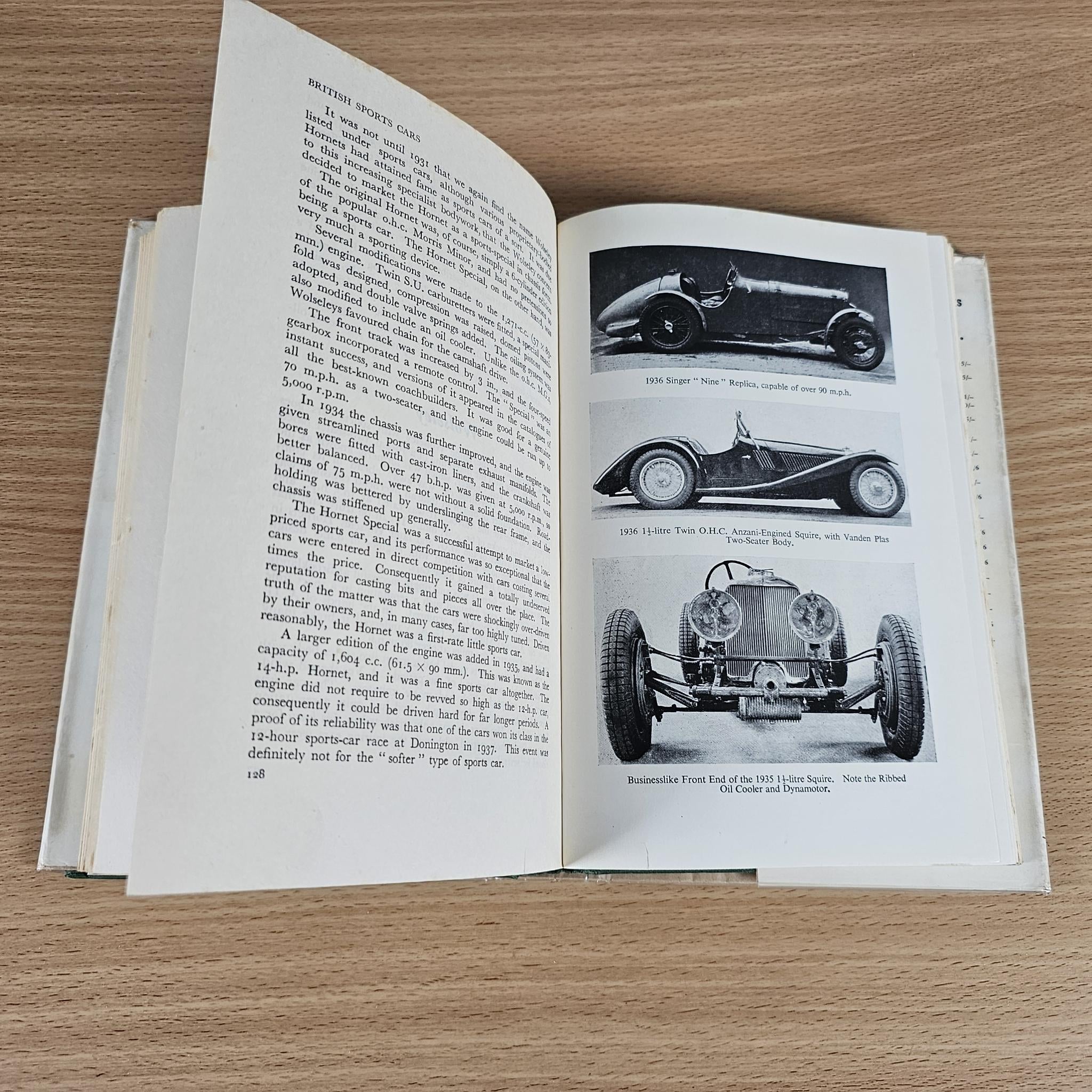 Open book spread with text on the left and black-and-white sports car photos